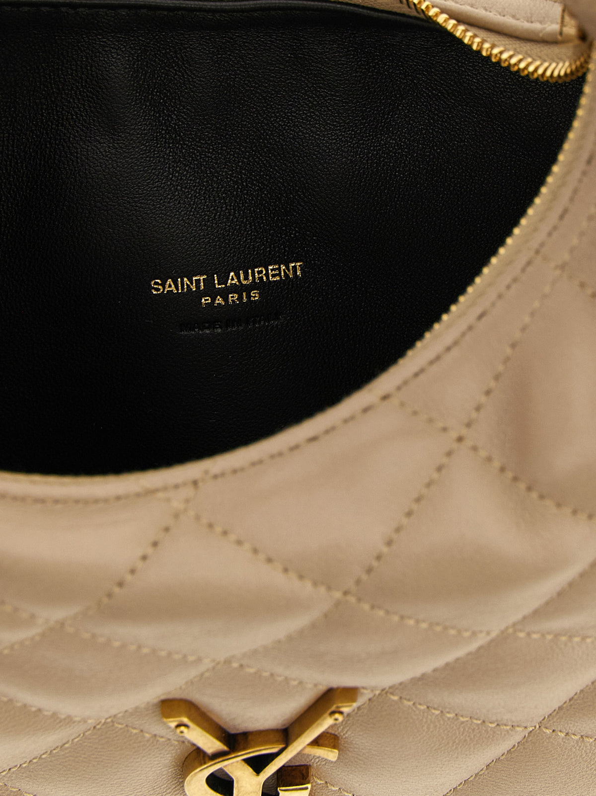 Elevate your style with the Saint Laurent Beige Lamb Leather Handbag, a masterpiece of Italian craftsmanship and timeless elegance, perfect for any occasion.