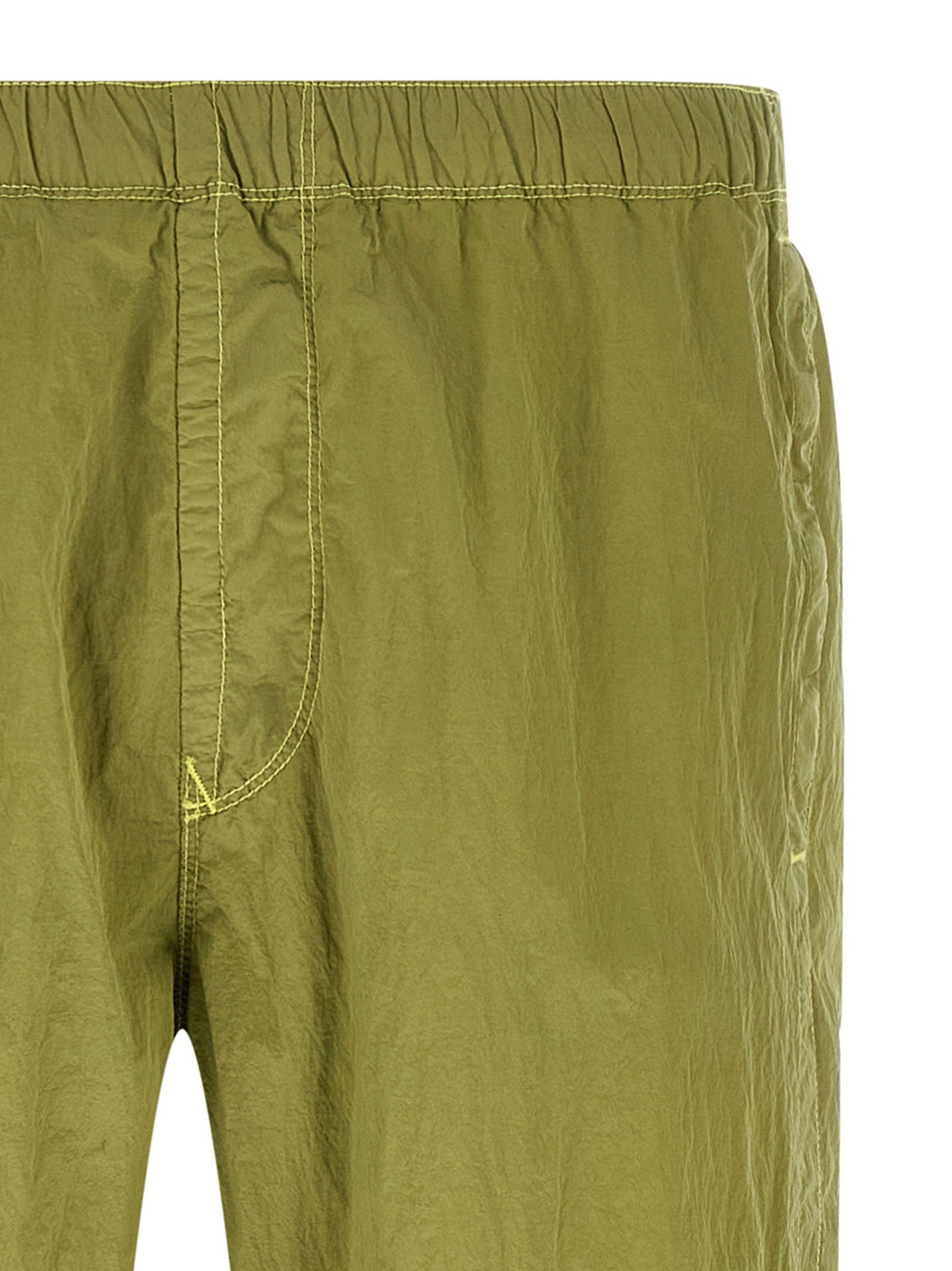 Elevate your athleisure with Stone Island Bicolor Polyamide Joggers, crafted from sustainable ECONYL nylon, merging luxury and functionality for the discerning individual.