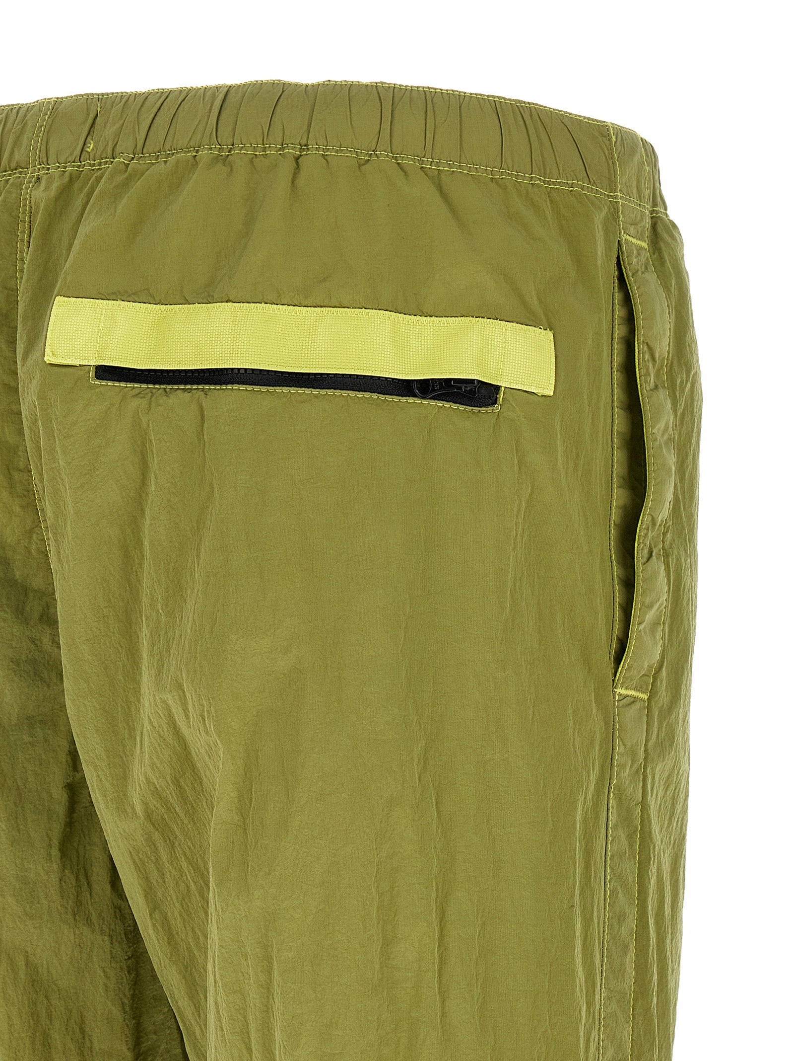 Elevate your athleisure with Stone Island Bicolor Polyamide Joggers, crafted from sustainable ECONYL nylon for a chic, tapered silhouette that seamlessly transitions from gym to urban elegance.