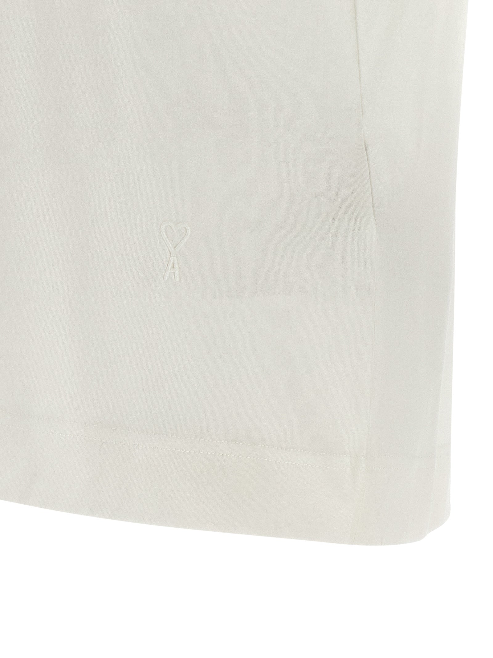 Discover the allure of the Ami Paris White Cotton T-Shirt, a semi-transparent masterpiece crafted for those who embrace elegance and sophistication in every moment.