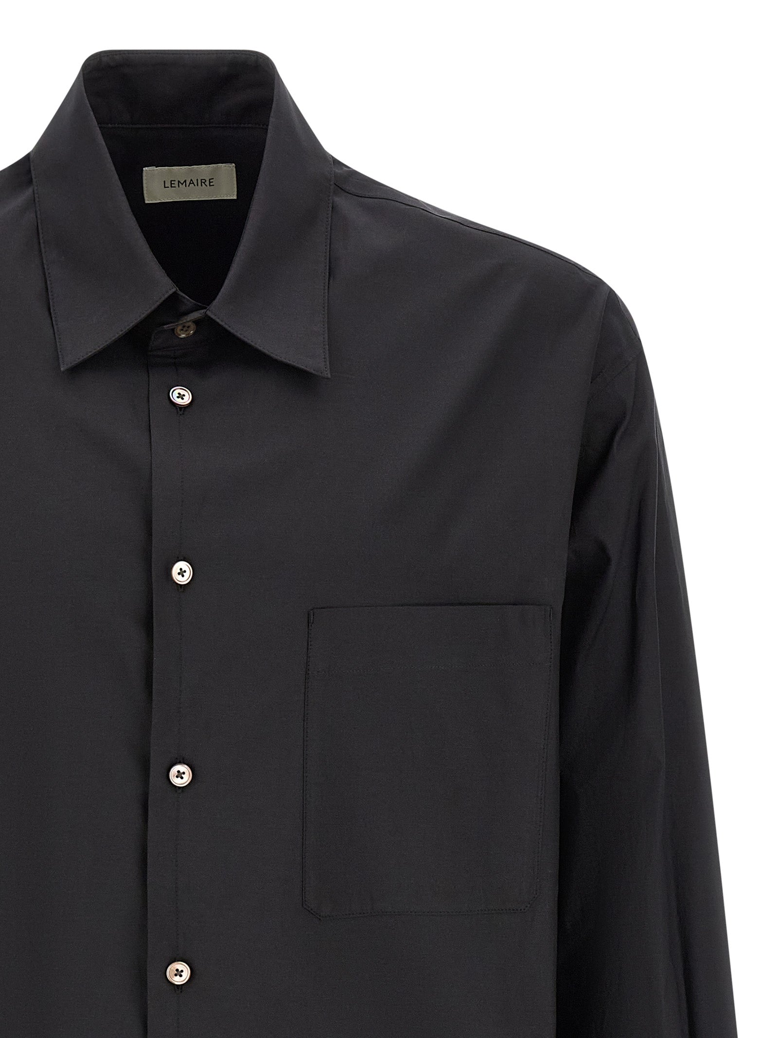 Elevate your style with the Lemaire Black Cotton Blouse, a luxurious blend of cotton and silk, embodying timeless elegance and sophisticated craftsmanship.