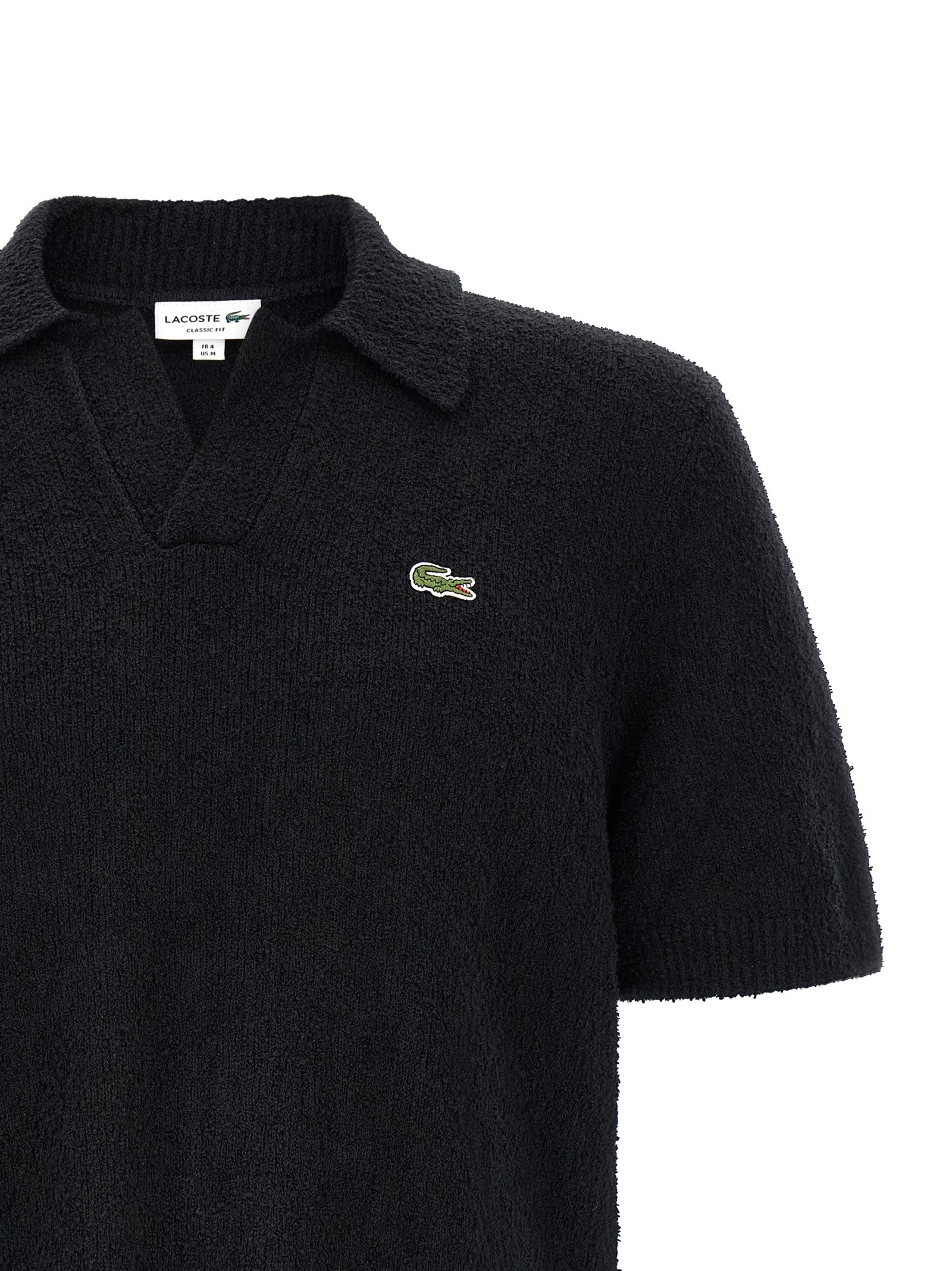 Elevate your style with the Lacoste Black Cotton Polo Shirt, a timeless blend of luxury and modernity, crafted for the discerning individual.