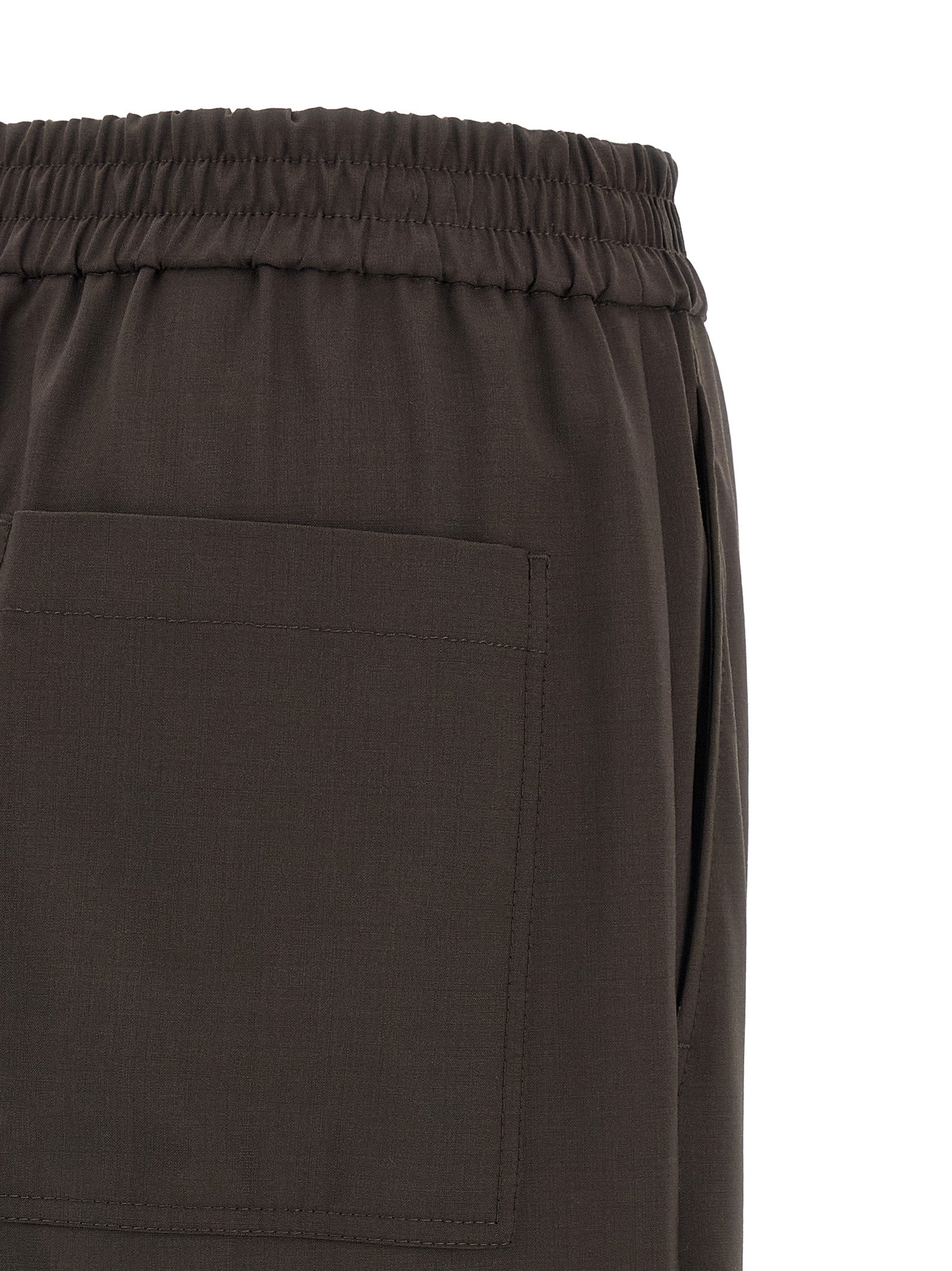 Experience the epitome of elegance with Brunello Cucinelli's Brown Virgin Wool Casual Pants, where Italian craftsmanship meets luxurious comfort for the discerning individual.