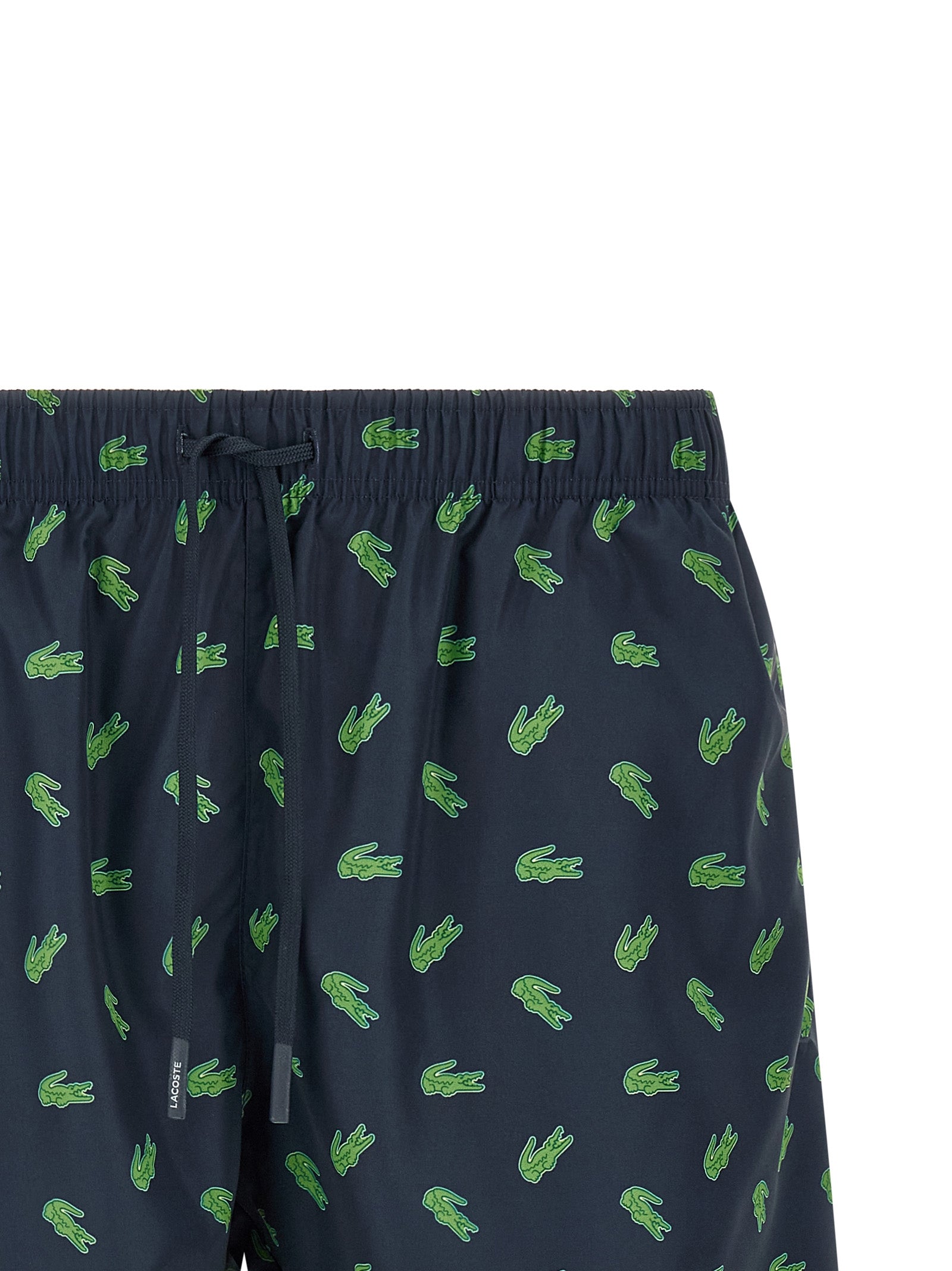 Indulge in the allure of Lacoste Blue Polyester Swim Shorts, where sustainable luxury meets bold design, perfect for those who embrace elegance and sophistication.