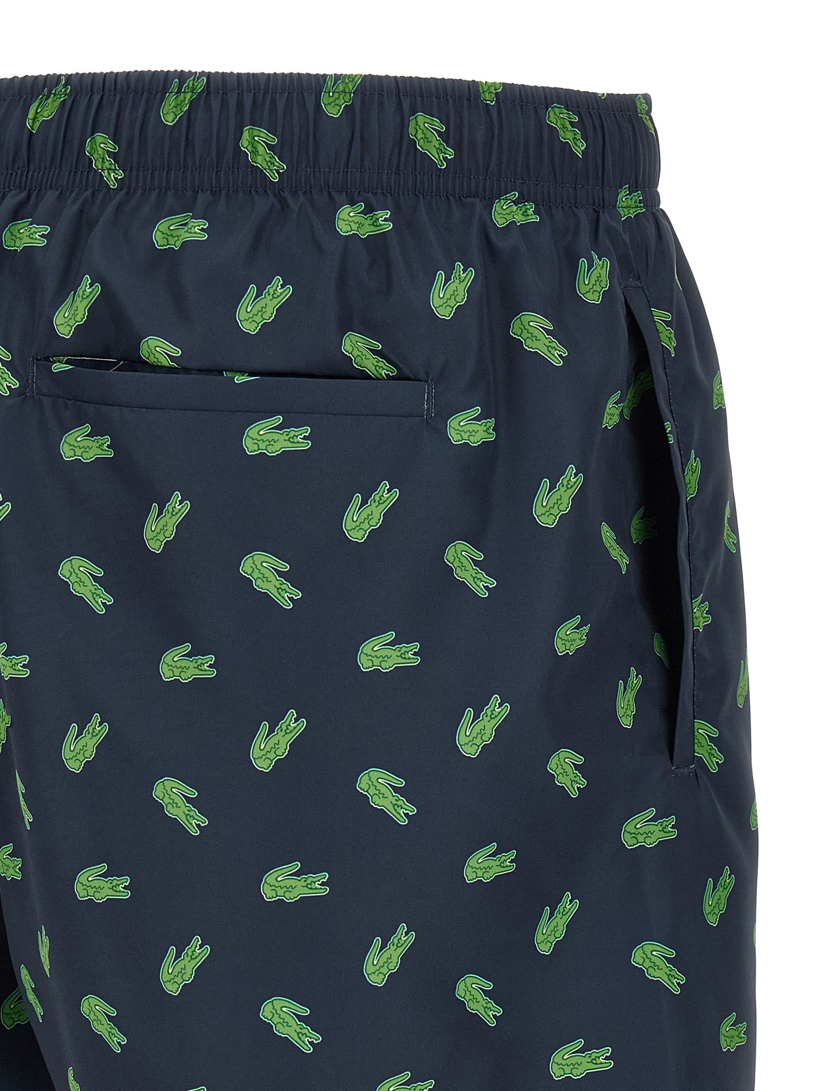 Elevate your swimwear collection with Lacoste Blue Polyester Swim Shorts, crafted from recycled materials for a chic, sustainable statement.