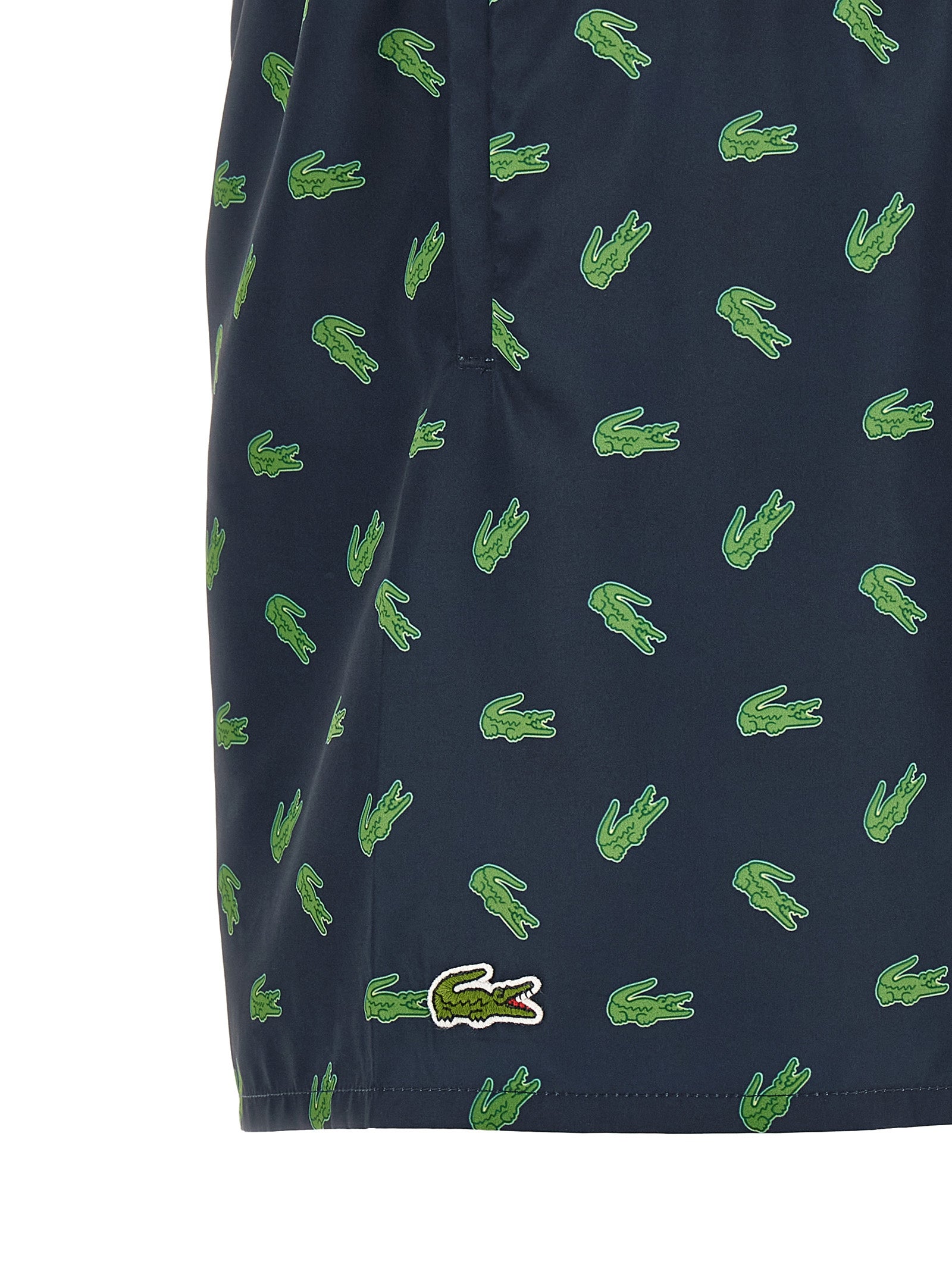 Elevate your swimwear collection with Lacoste's Blue Polyester Swim Shorts, crafted from quick-drying recycled materials, embodying sustainable sophistication and timeless style.