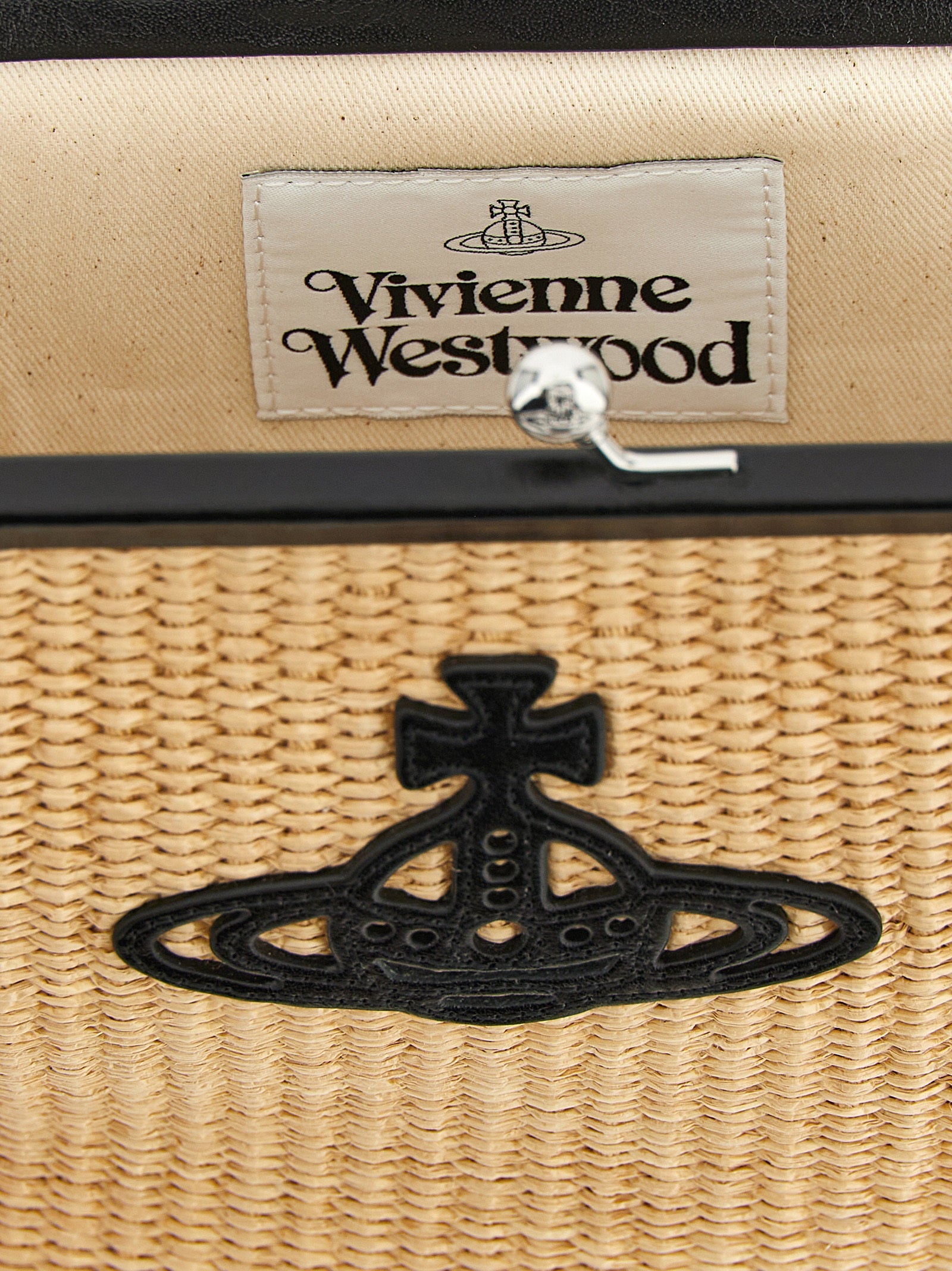 Discover the Vivienne Westwood Beige Cotton Clutch, a masterpiece of artisanal craftsmanship, blending elegance and individuality for the discerning connoisseur.