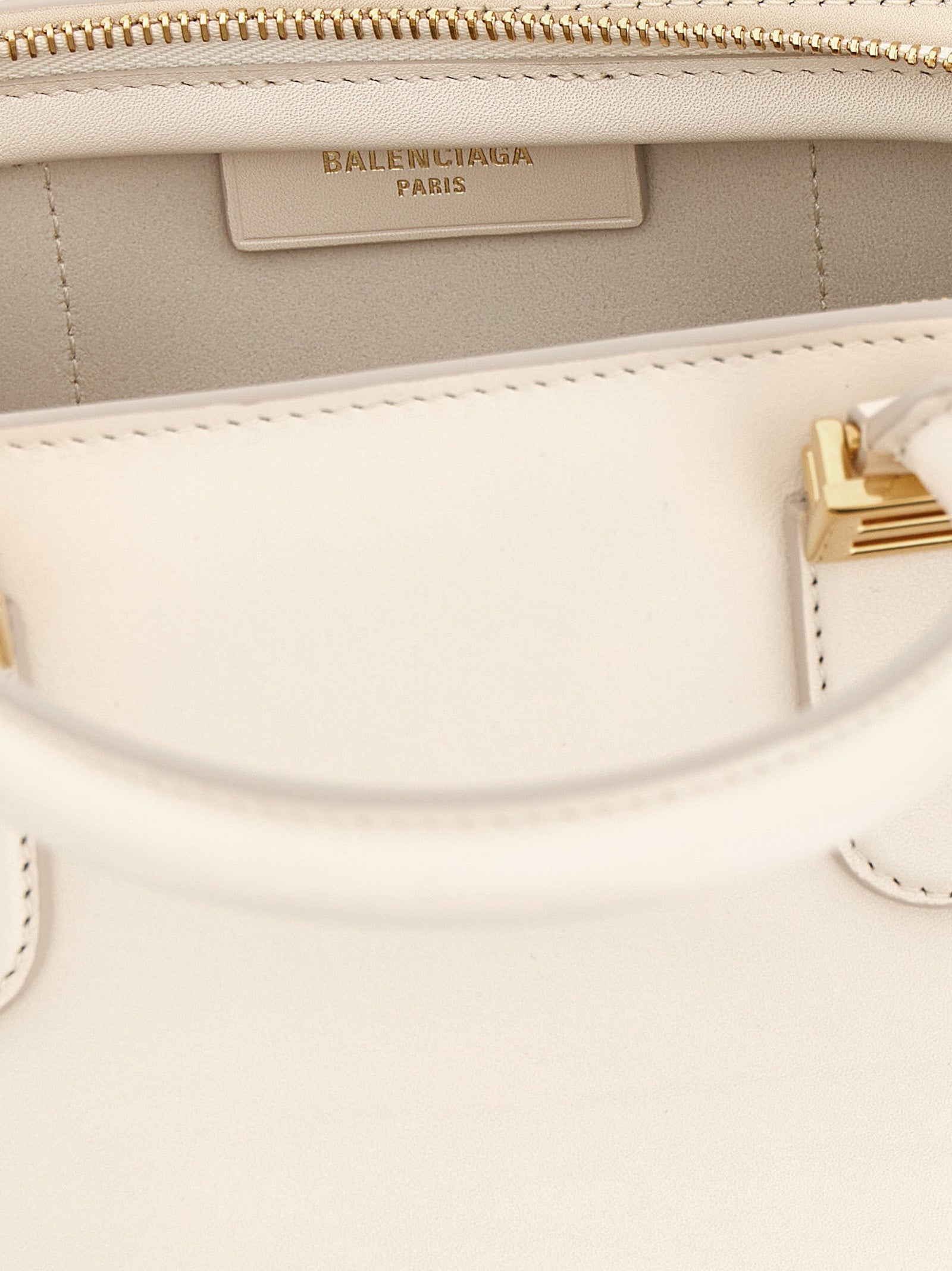Indulge in the allure of the Balenciaga White Calfskin Handbag, a masterpiece of Italian craftsmanship, blending luxurious materials with timeless elegance for the discerning individual.