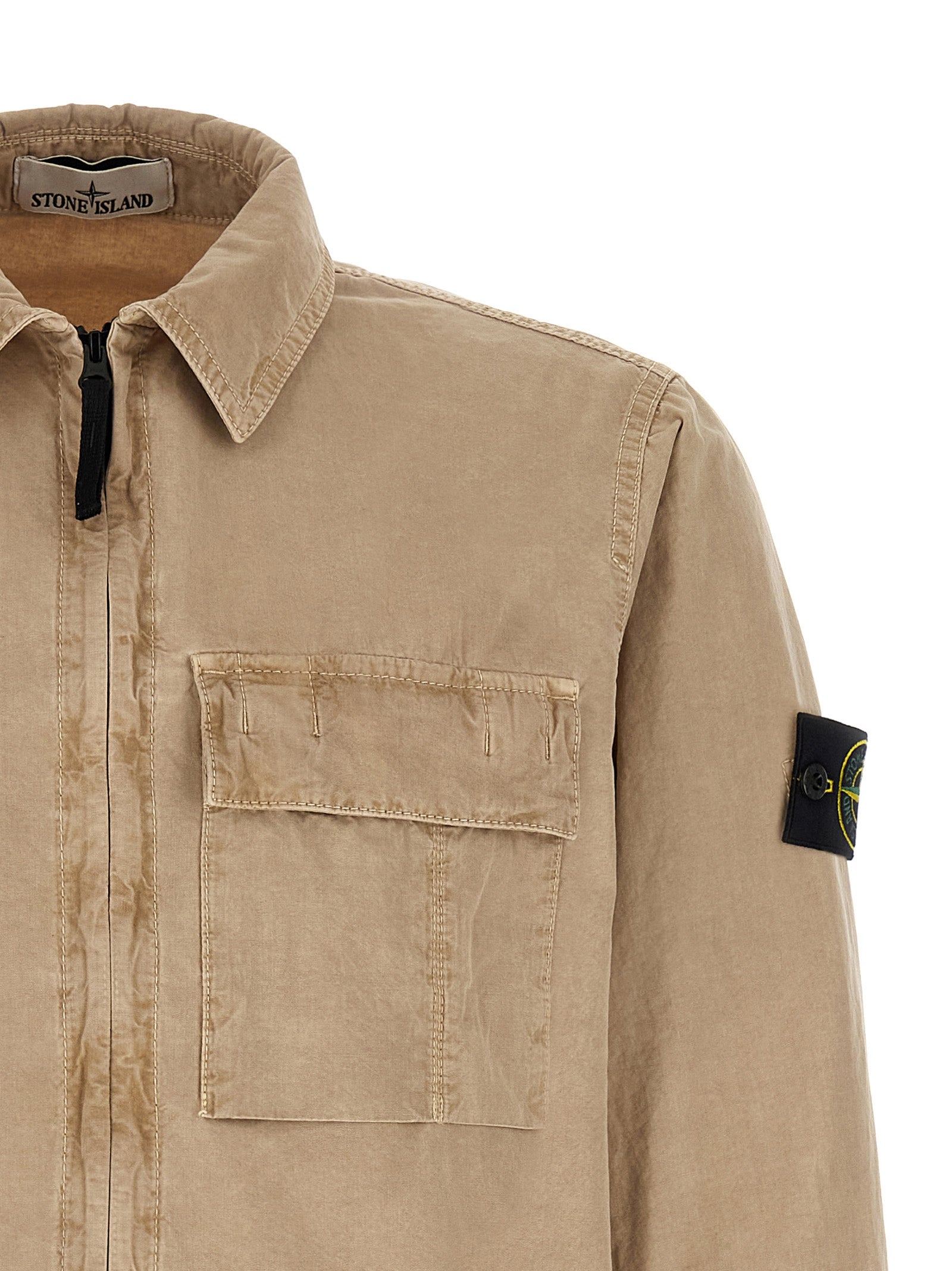 Elevate your wardrobe with the Stone Island Beige Cotton Blouse, a masterpiece of vintage charm and modern elegance, crafted from luxurious garment-dyed cotton.