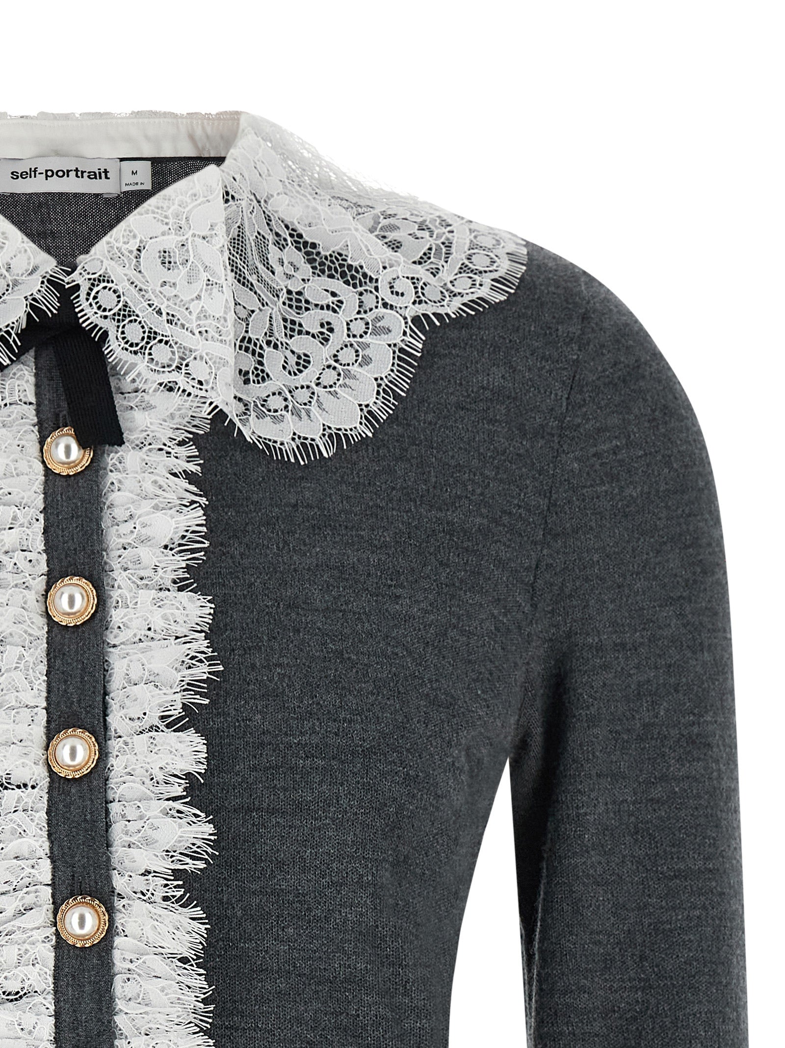 Indulge in the elegance of the Self-Portrait Gray Wool Cardigan, a masterpiece of 100% stretch wool, featuring a lace collar and jewel button closures for timeless sophistication.