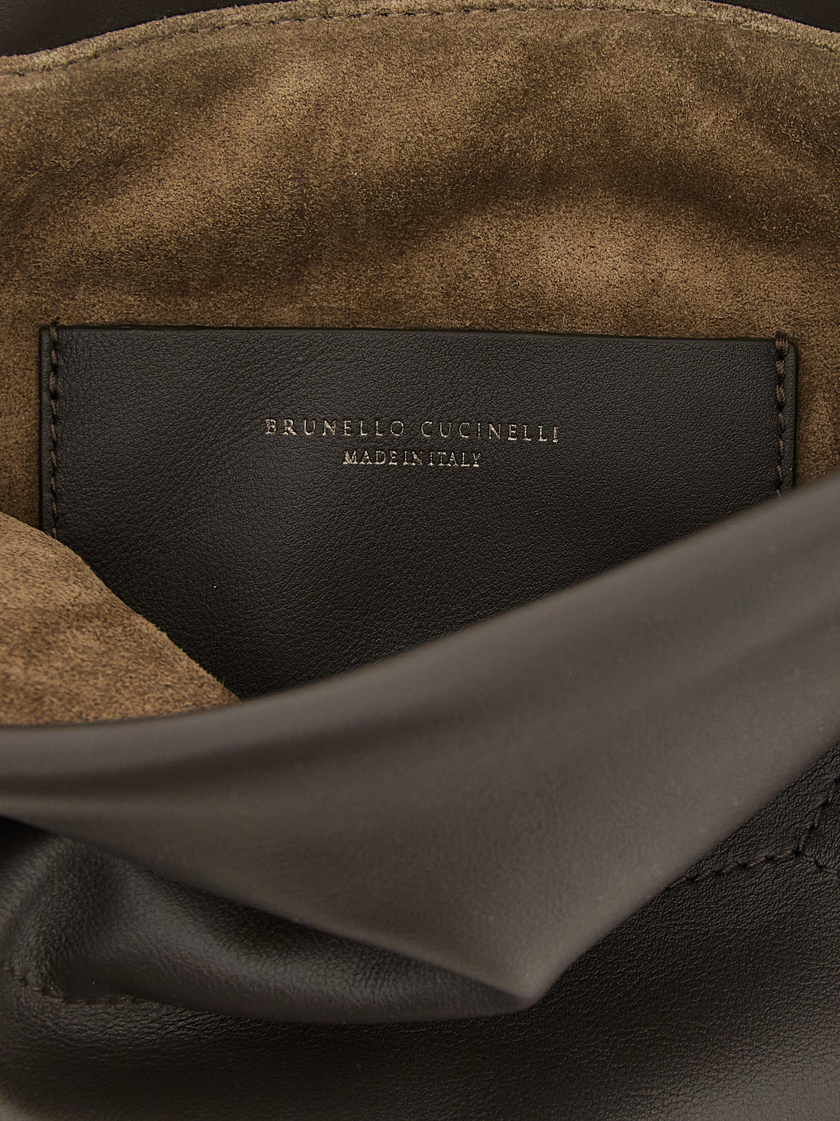 Elevate your style with the Brunello Cucinelli Brown Calfskin Clutch Bag, a masterpiece of Italian craftsmanship that embodies luxury and sophistication for every occasion.