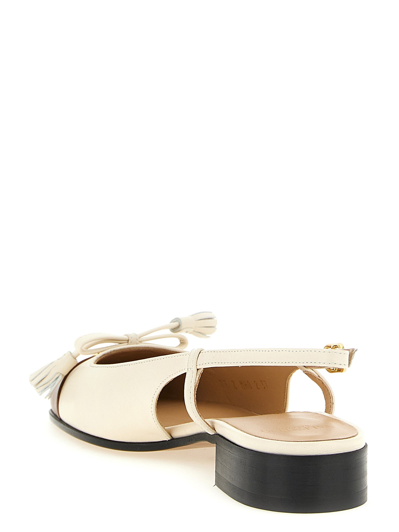 Step into a world of refined elegance with Valentino Garavani's Black Leather Ballet Flats, where exquisite craftsmanship meets modern sophistication for the discerning individual.