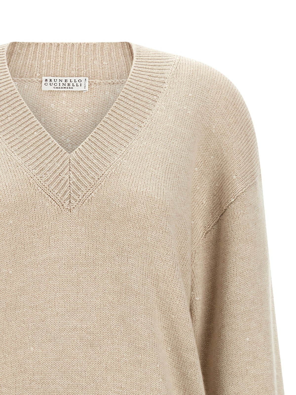 Indulge in the exquisite Brunello Cucinelli Beige Cashmere Cardigan, where luxurious cashmere and silk blend effortlessly, embodying timeless elegance for every occasion.