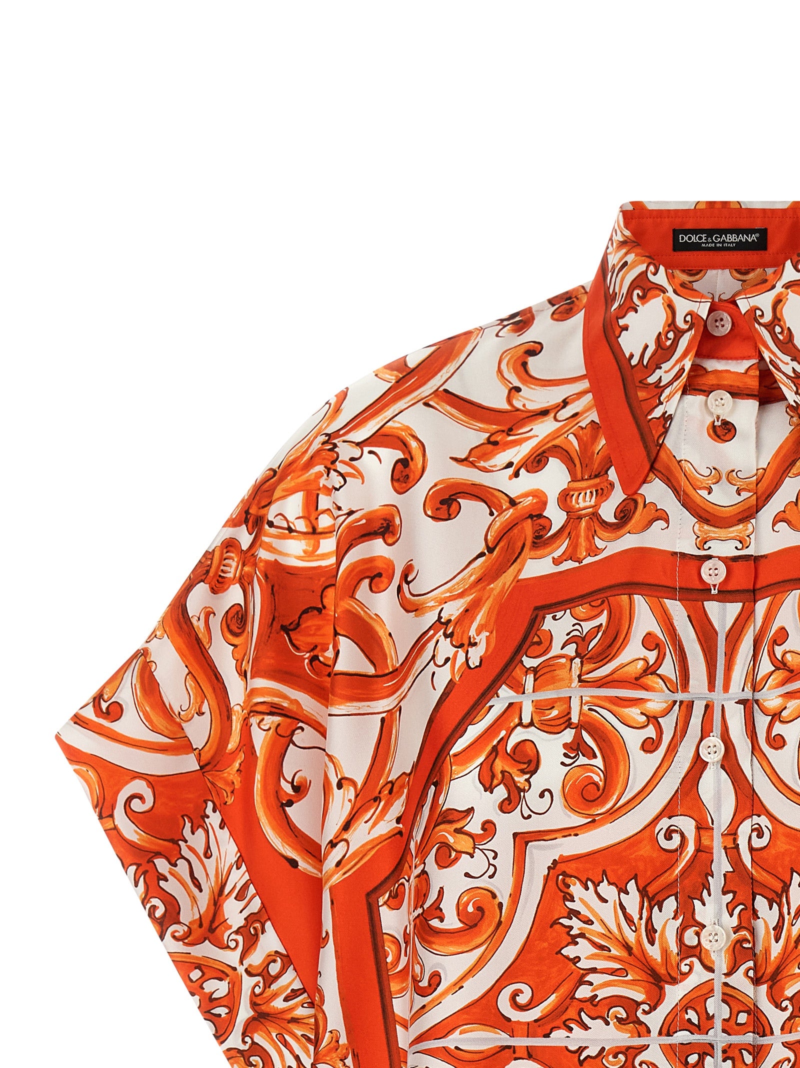 Elevate your wardrobe with the Dolce & Gabbana Orange Silk Blouse, a masterpiece of Italian craftsmanship that embodies elegance, sophistication, and unique artistry.