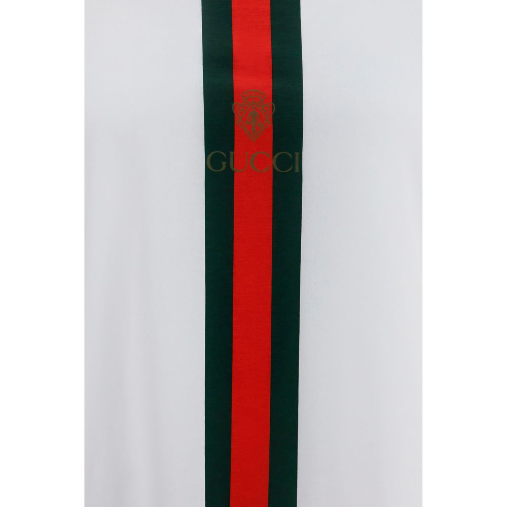 Discover the Gucci White Cotton T-Shirt, a luxury essential crafted from soft cotton, featuring iconic Web Stripe and crest print, perfect for the discerning individual.