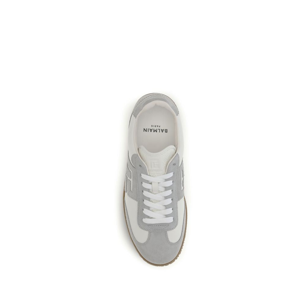 Experience the allure of Balmain White Calf Leather Bos Taurus Athletic Sneakers, where exquisite craftsmanship meets luxury in a timeless design, perfect for the discerning individual.