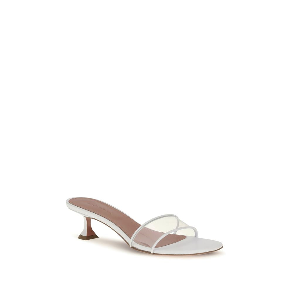 Indulge in the Amina Muaddi White Calf Leather Bos Taurus Sandals, where artisanal craftsmanship meets modern elegance, perfect for elevating any sophisticated ensemble.