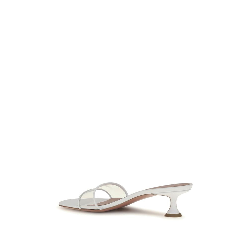 Discover the Amina Muaddi White Calf Leather Bos Taurus Sandals, a masterpiece of luxury and artistry, crafted for those who embrace elegance and sophistication.