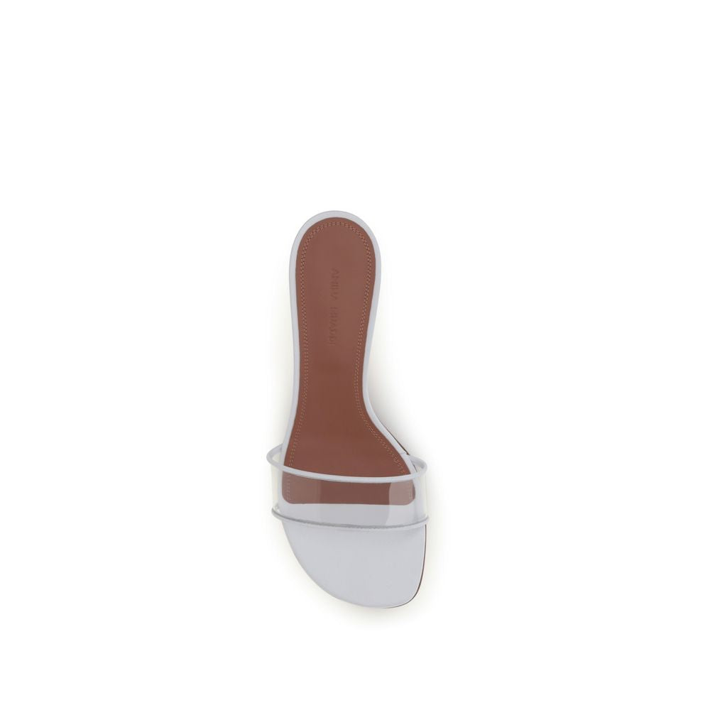 Discover the Amina Muaddi White Calf Leather Bos Taurus Sandals, a masterpiece of luxury craftsmanship that effortlessly elevates your style with its iconic sculptural heel and refined elegance.