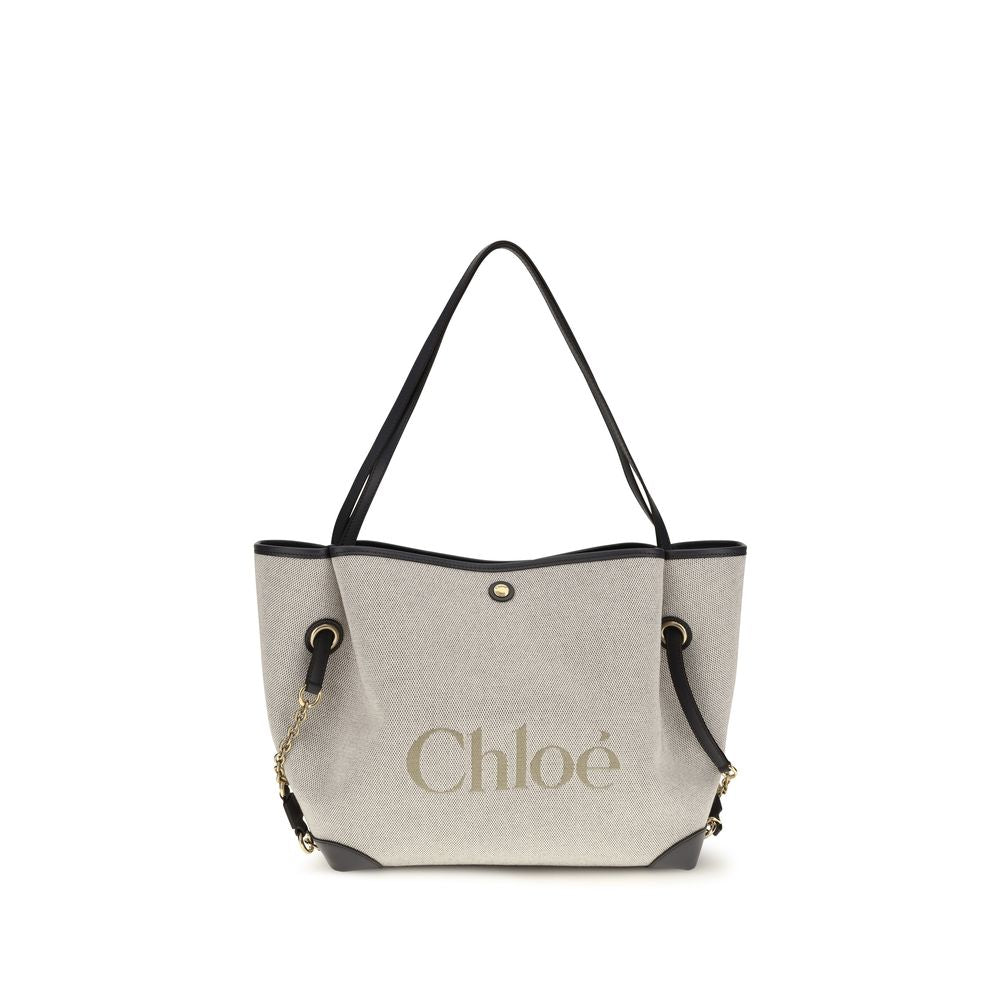 Indulge in the Chloé Gray Cotton Shoulder Bag, a masterpiece of cotton canvas and calfskin, embodying timeless elegance and modern sophistication for the discerning individual.