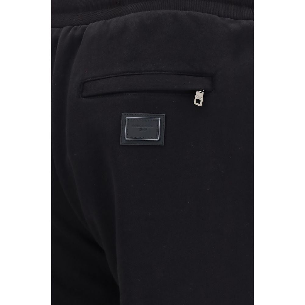 Experience the allure of Dolce & Gabbana's Black Cotton Joggers, crafted from premium cotton for unparalleled comfort and sophistication, embodying modern luxury.