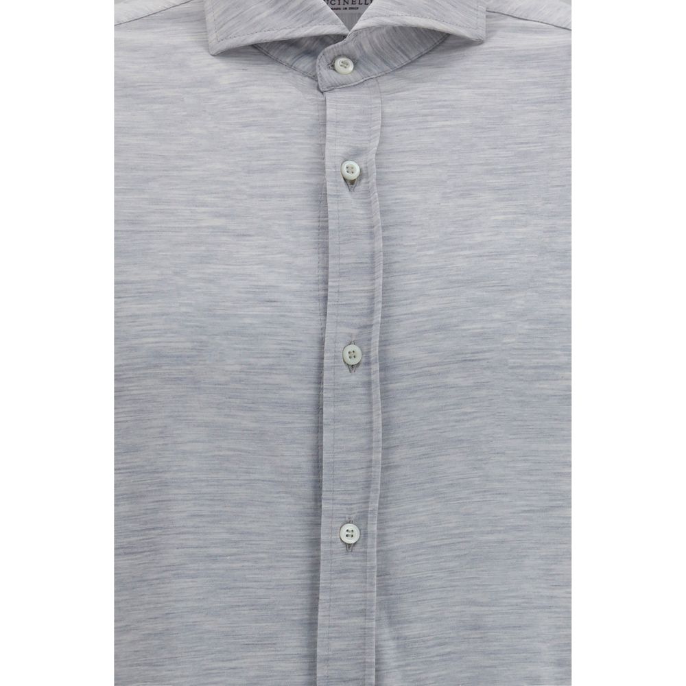 Discover the Brunello Cucinelli Gray Silk Dress Shirt, a luxurious blend of silk and cotton, epitomizing timeless elegance and refined sophistication for the discerning individual.