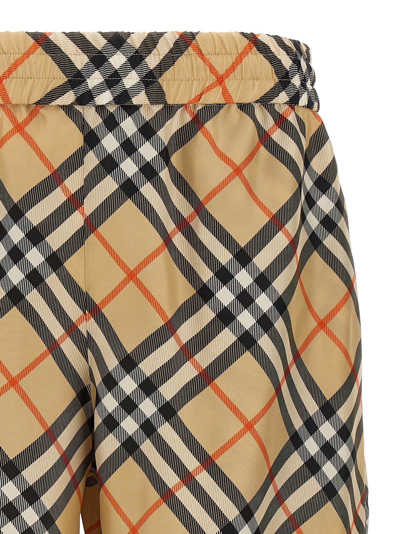 Indulge in the exquisite Burberry Beige Satin Bermuda Shorts, crafted from 100% mulberry silk, embodying effortless elegance and timeless sophistication for the discerning individual.