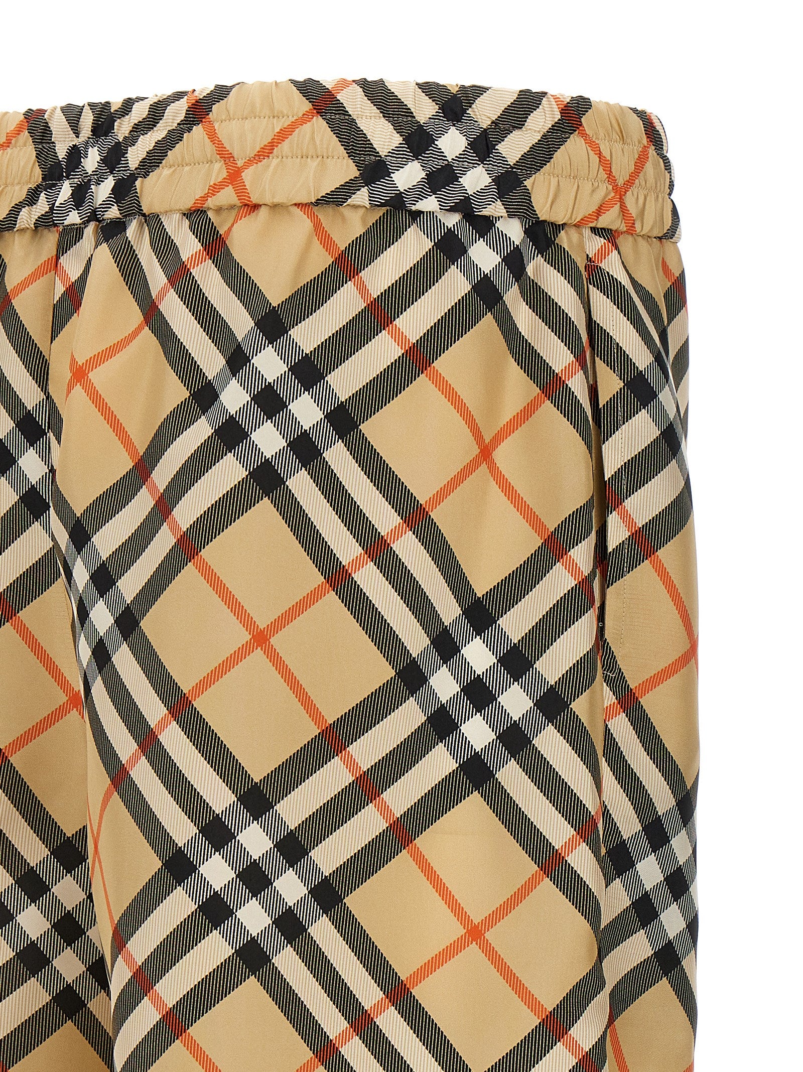 Elevate your style with Burberry Beige Satin Bermuda Shorts, crafted from luxurious mulberry silk, embodying effortless sophistication for the discerning individual.