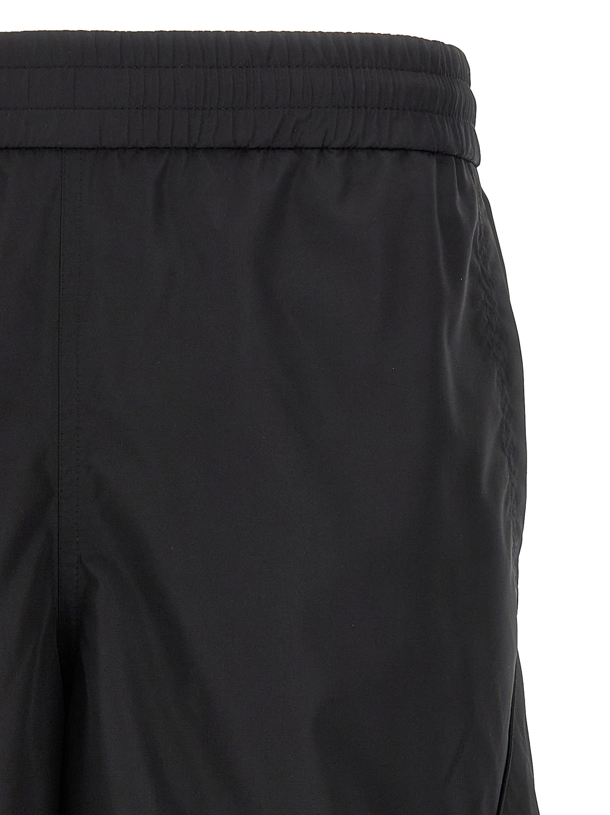 Indulge in the elegance of Givenchy Black Polyester Bermuda Shorts, where luxurious craftsmanship meets modern sophistication, perfect for the discerning trendsetter.