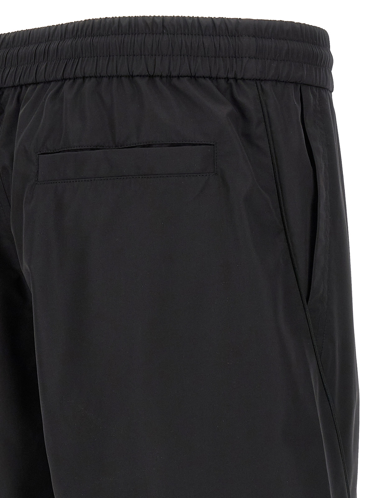 Indulge in the effortless luxury of Givenchy Black Polyester Bermuda Shorts, where sophisticated design meets unparalleled comfort, perfect for the modern trendsetter.