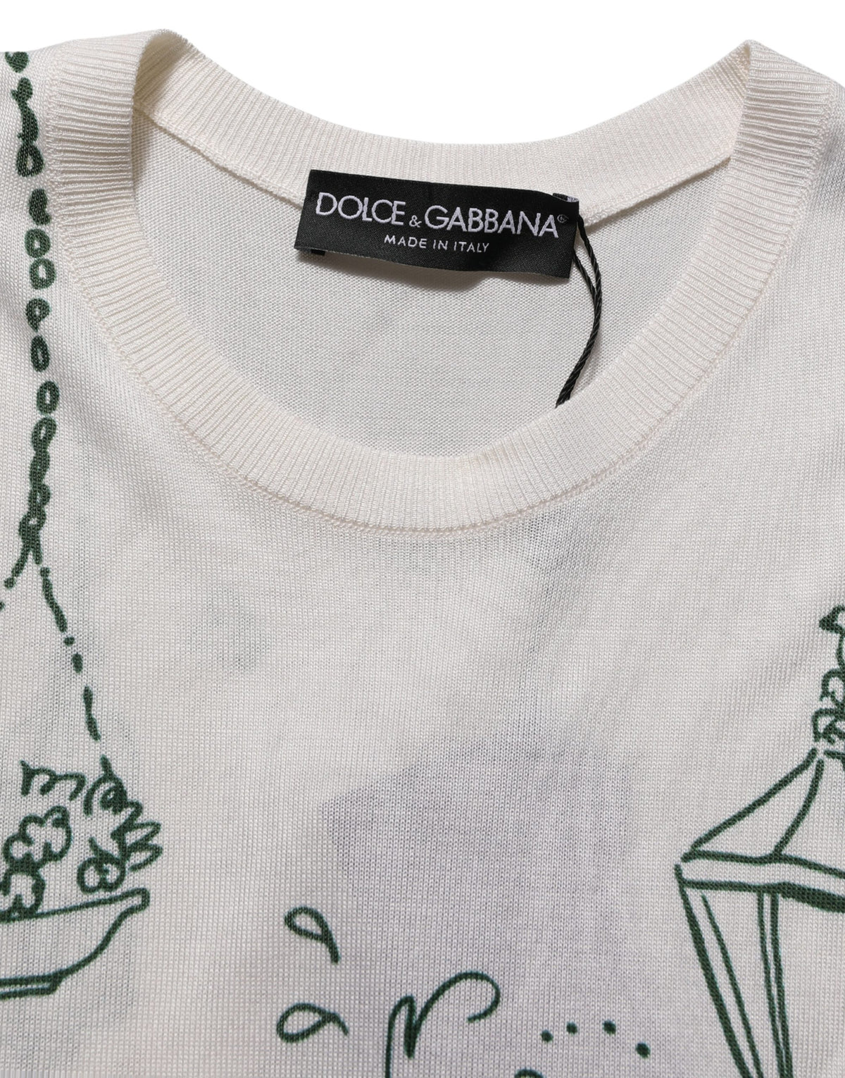 Indulge in the exquisite Dolce & Gabbana White Silk Knit Garden Fountain Print Tank Top, a masterpiece of Italian craftsmanship that embodies timeless elegance and luxurious allure.