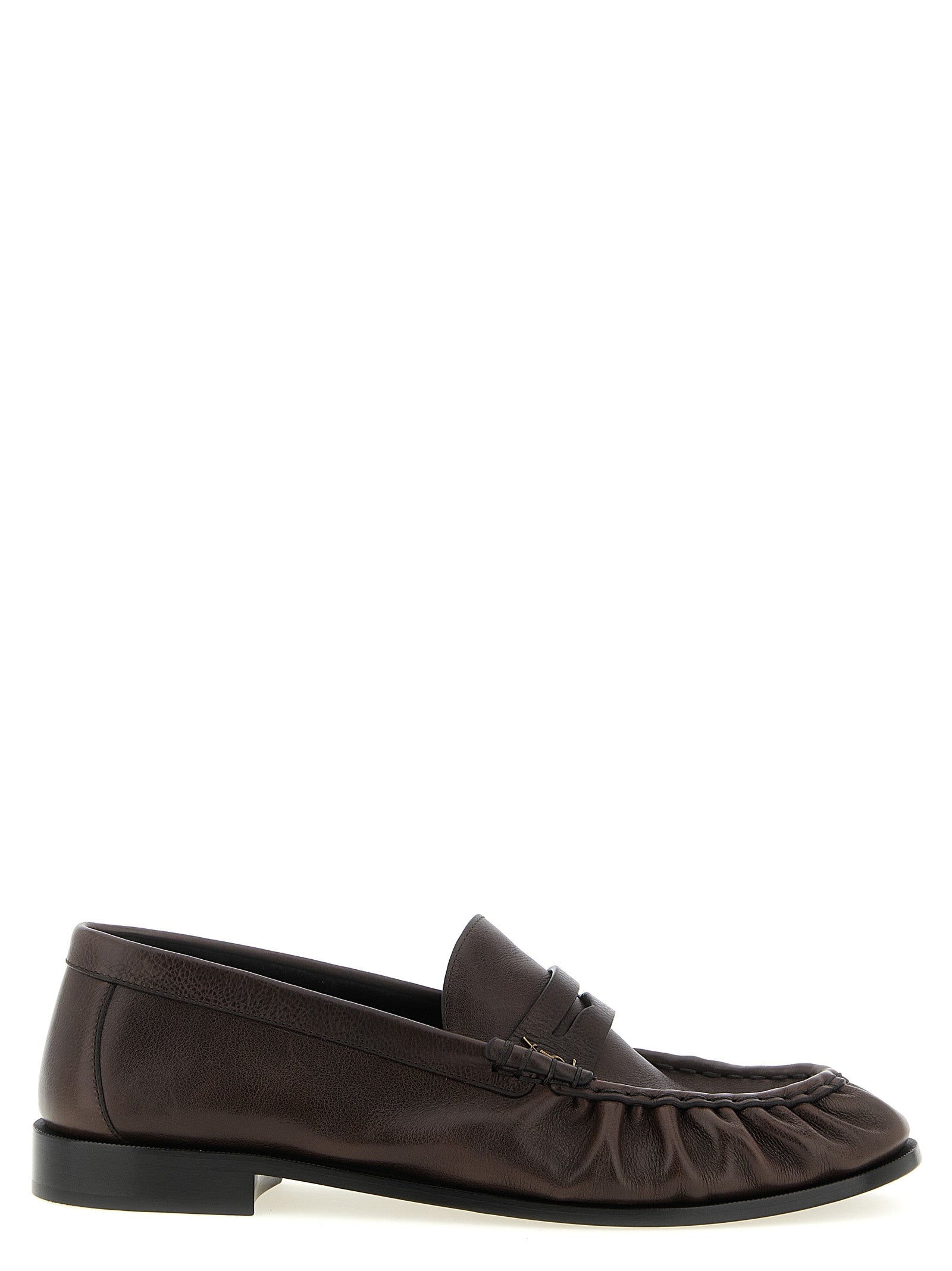 Elevate your style with Saint Laurent's Brown Calfskin Slip-On Loafers, where exquisite craftsmanship meets timeless elegance, perfect for the discerning connoisseur.