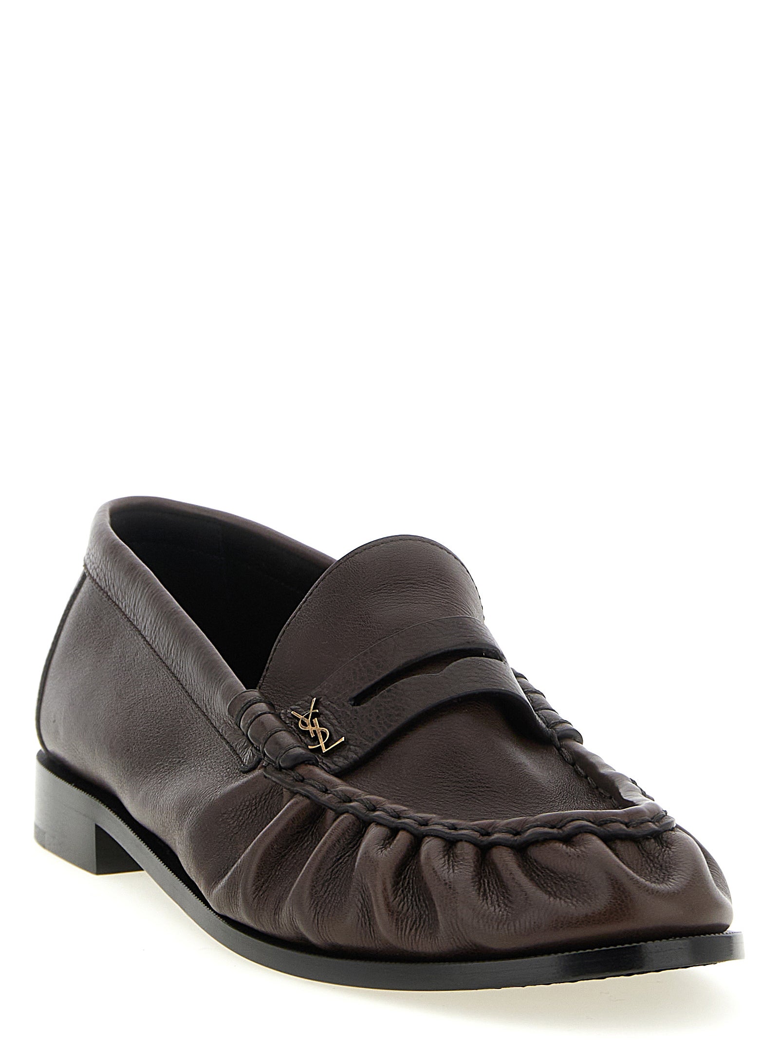 Elevate your style with Saint Laurent's Brown Calfskin Slip-On Loafers, where exquisite Italian craftsmanship meets timeless elegance for the discerning connoisseur.