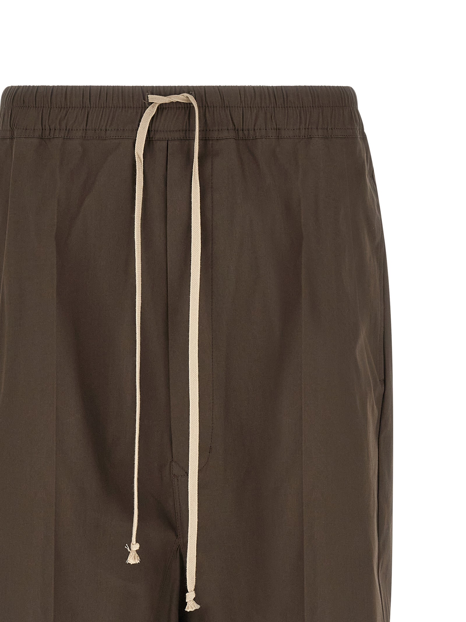 Elevate your wardrobe with Rick Owens Brown Cotton Bermuda Shorts, crafted from luxurious cotton poplin, embodying avant-garde elegance for the discerning individual.