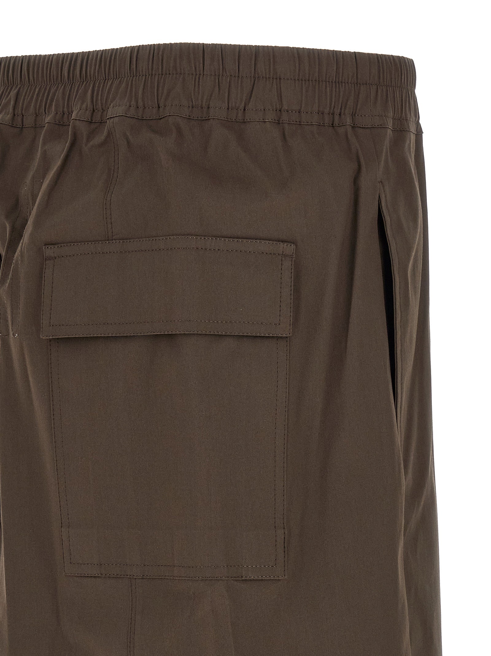 Indulge in the avant-garde luxury of Rick Owens Brown Cotton Bermuda Shorts, crafted from premium cotton poplin for a daring silhouette that redefines sophistication.