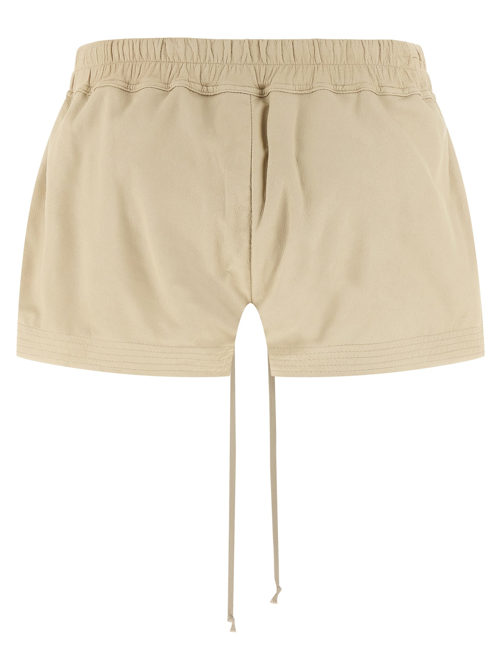 Elevate your style with Rick Owens' exclusive Beige Lamb Leather Bermuda Shorts, a masterpiece of luxurious craftsmanship that redefines contemporary elegance.