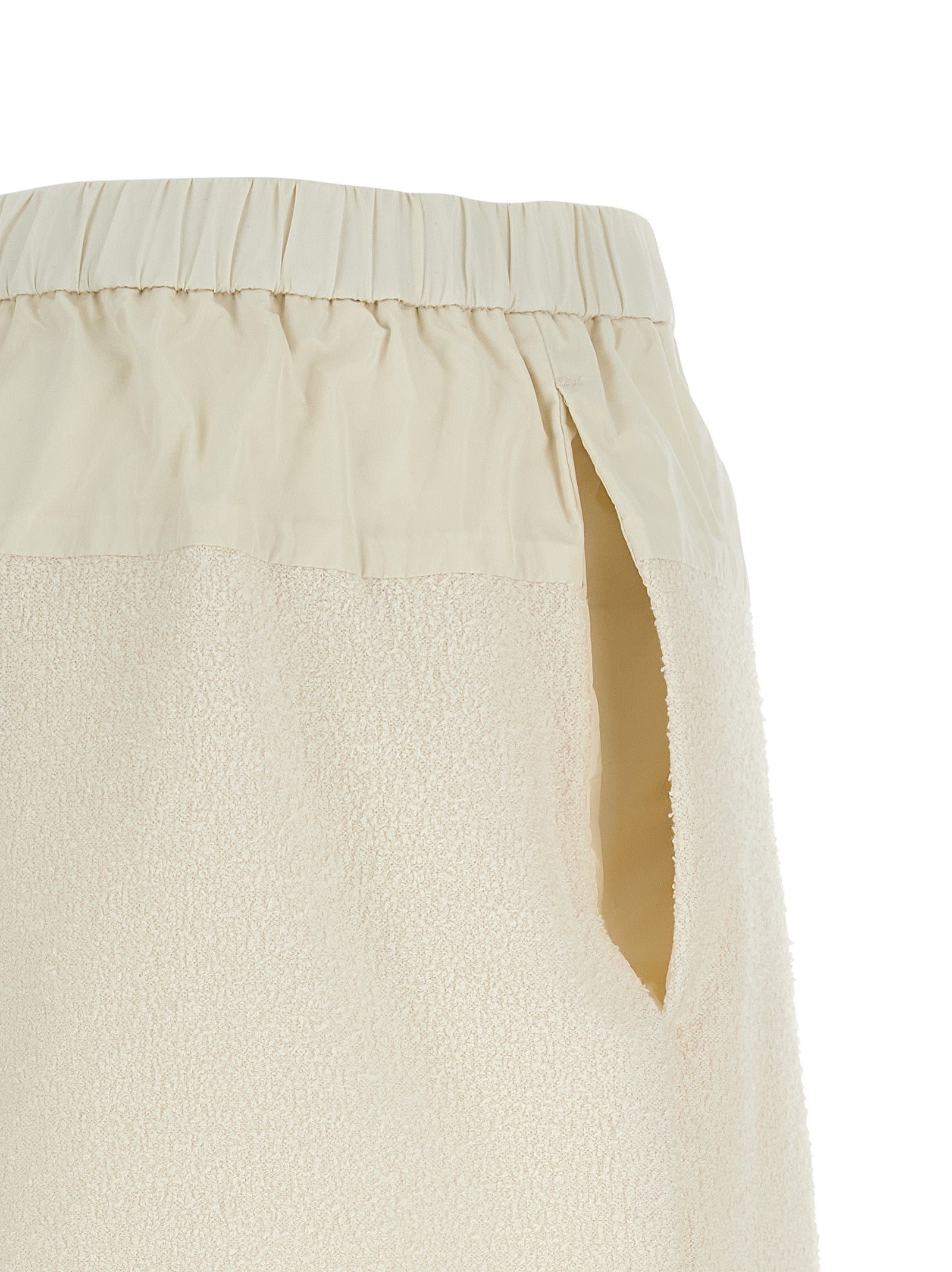 Elevate your summer wardrobe with Moncler's White Polyester Bermuda Shorts, crafted from luxurious bouclé fabric for effortless sophistication and timeless style.