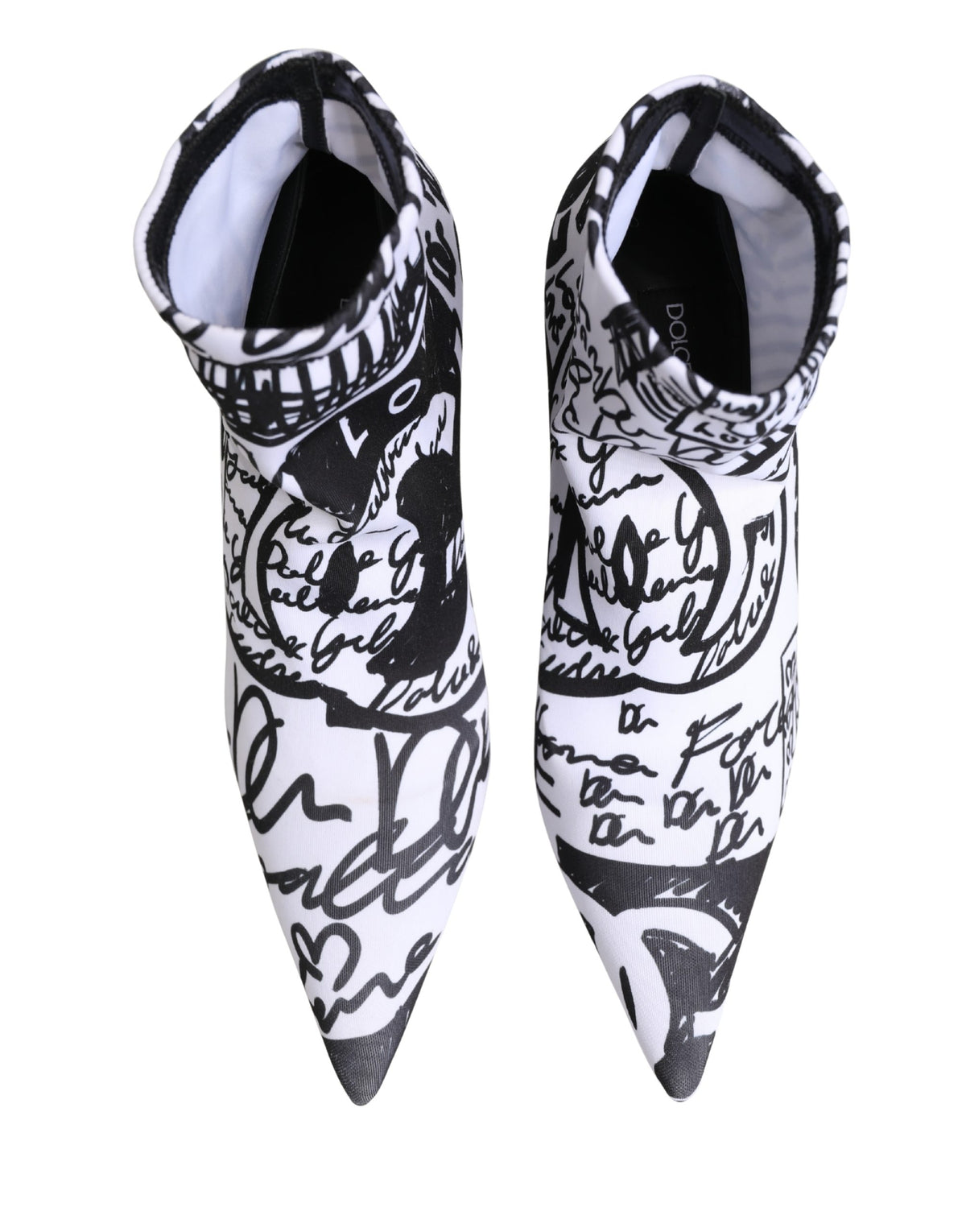 Elevate your style with Dolce & Gabbana's White Graffiti Stretch Ankle Boots, where exquisite Italian craftsmanship meets bold artistry for the discerning individual.