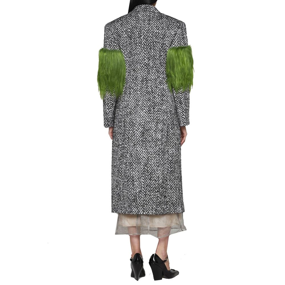 Elevate your wardrobe with the Prada Gray Wool Coat, a masterpiece of herringbone craftsmanship, embodying timeless elegance and luxurious sophistication.