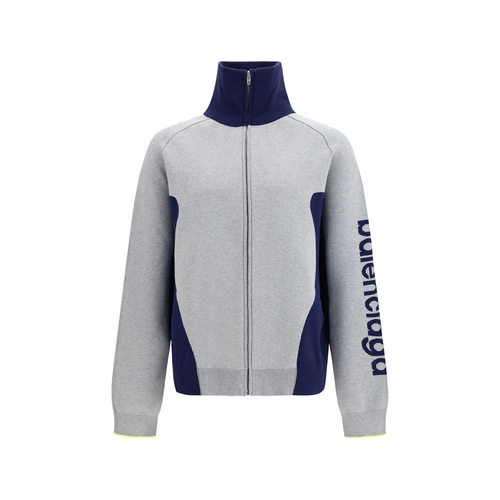 Experience the Balenciaga Gray Cotton Sweatshirt, a luxurious blend of cotton and polyamide, redefining modern elegance with its sophisticated design and impeccable craftsmanship.