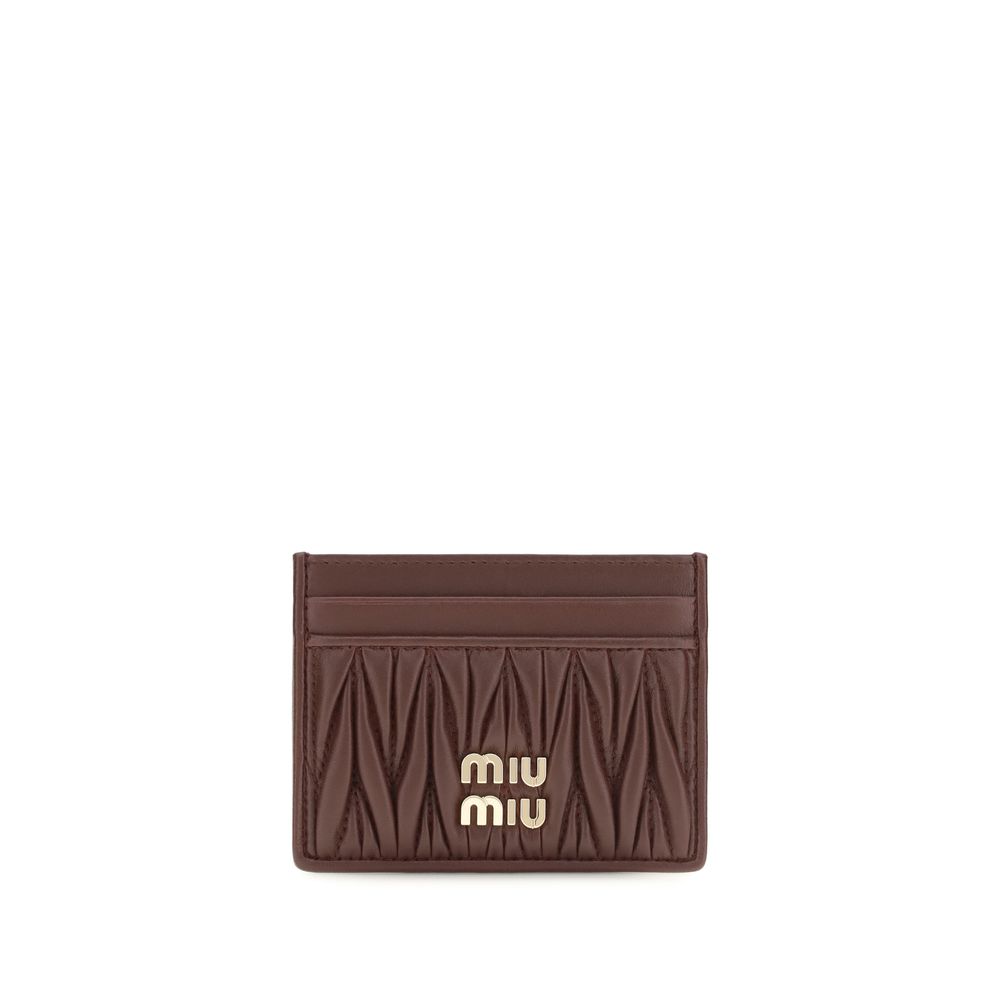 Indulge in the Miu Miu Bordeaux Lamb Ovis Aries Wallet, a masterpiece of matelassé nappa leather, where elegance meets functionality for the discerning connoisseur.