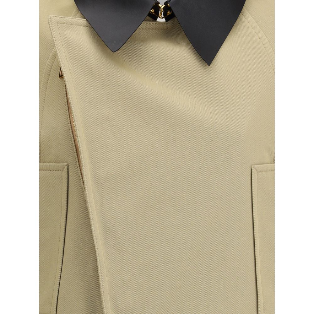 Elevate your style with Givenchy's Beige Cotton Clothing, an exquisite blend of cotton and wool, embodying timeless elegance and contemporary sophistication for the discerning fashion aficionado.