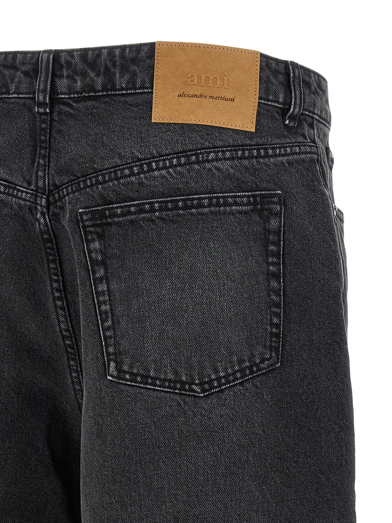 Discover the AMI PARIS Black Cotton Bermuda Shorts, where luxurious 100% cotton meets a flared silhouette, perfect for those who embrace sophistication and style.
