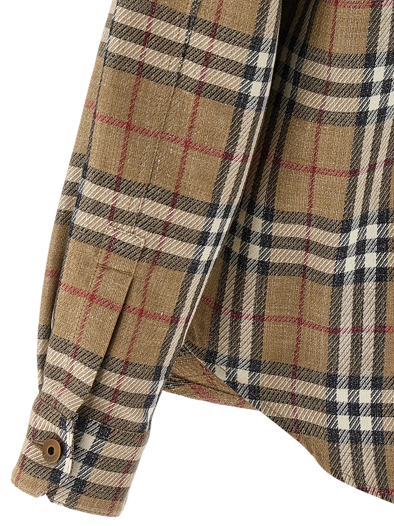 Indulge in the Burberry Brown Cotton Blouse, a masterful blend of cotton and linen, exuding timeless elegance and sophistication for the discerning individual.