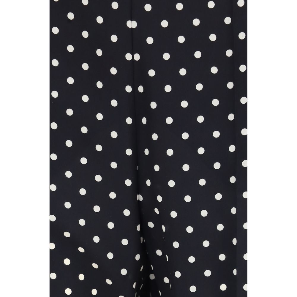 Indulge in the exquisite allure of Valentino Black Silk Cropped Pants, crafted from luxurious crêpe de chine, merging timeless elegance with modern sophistication for the discerning individual.