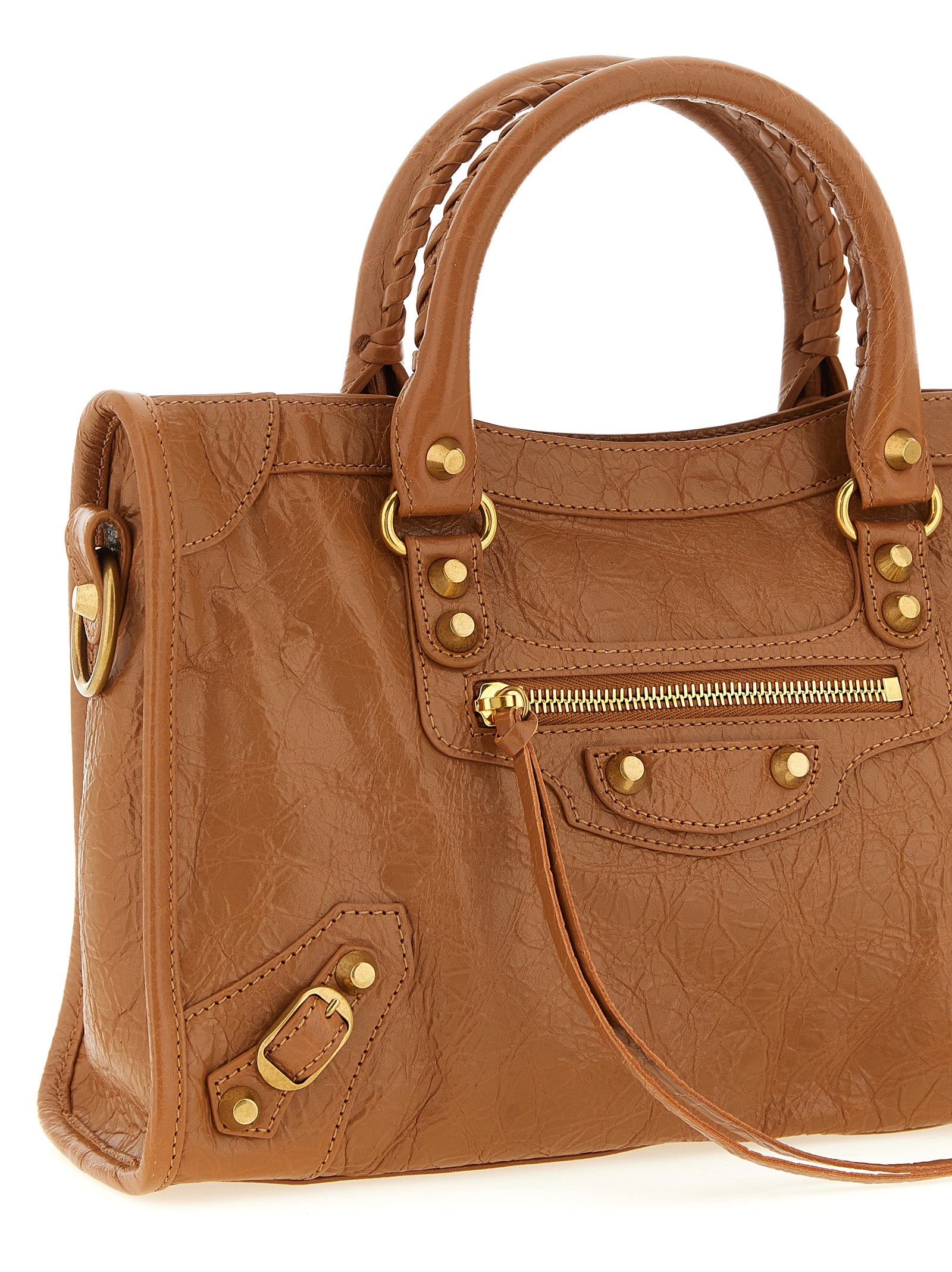 Indulge in the exquisite allure of the Balenciaga Brown Lamb Leather Handbag, a masterpiece of craftsmanship that elevates your style with timeless elegance and sophisticated versatility.