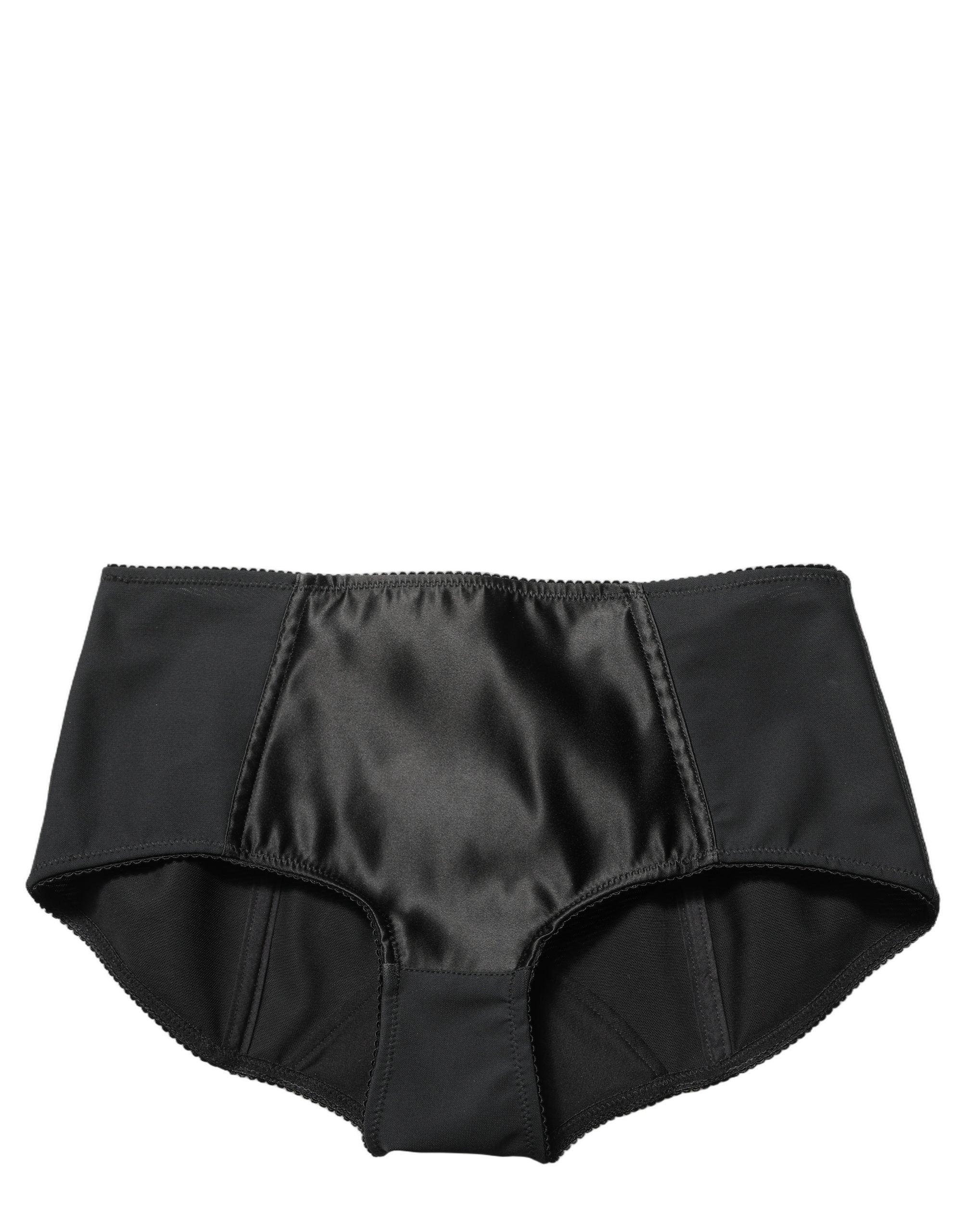 Indulge in the allure of Dolce & Gabbana's Black Low Waist Satin Culotte Hotpants Shorts, crafted in Italy for the discerning individual who appreciates exquisite luxury and timeless elegance.