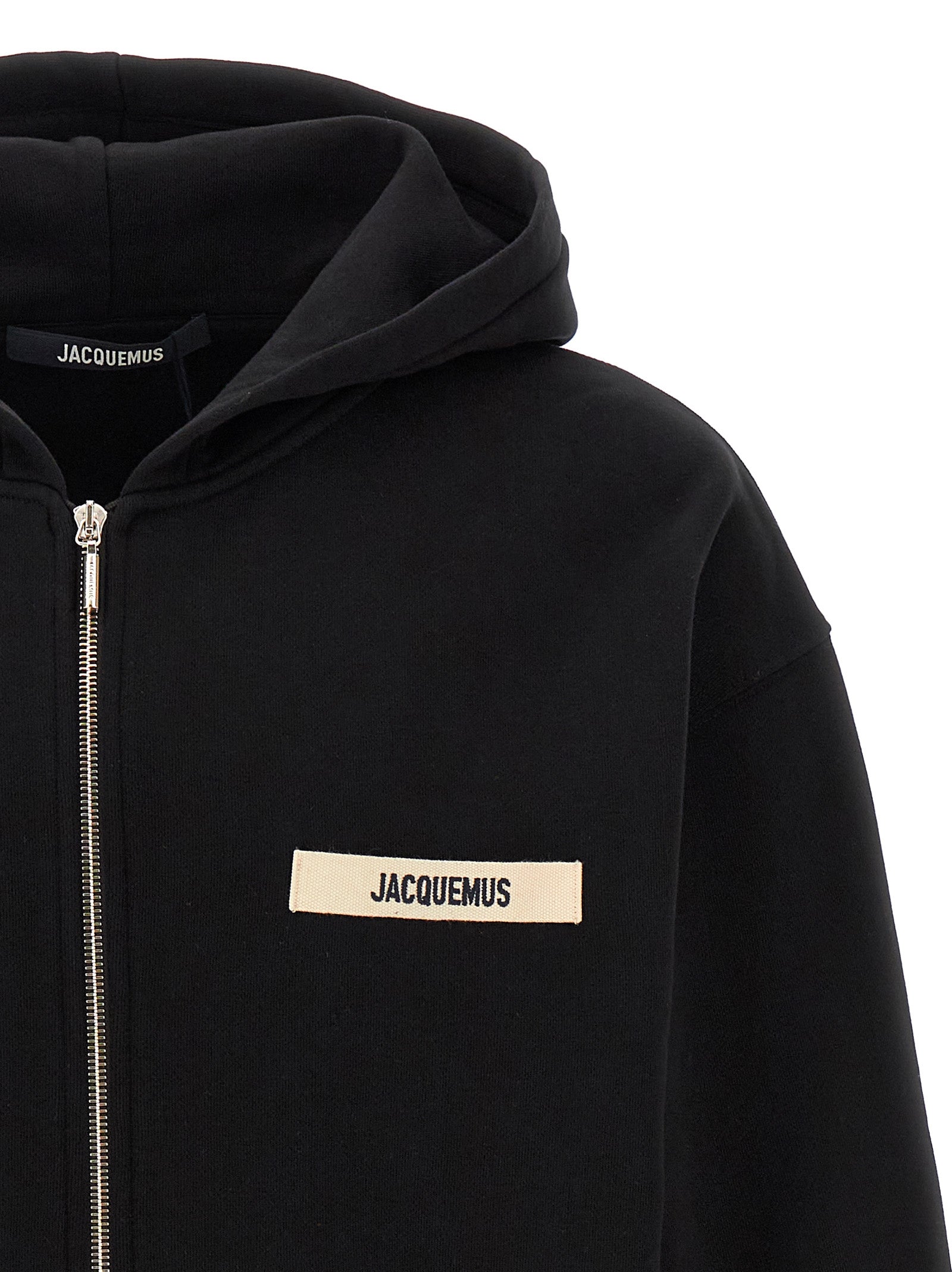 Indulge in the Jacquemus Black Cotton Sweatshirt, a luxurious blend of comfort and sophistication, crafted in Portugal to elevate your style with effortless elegance.