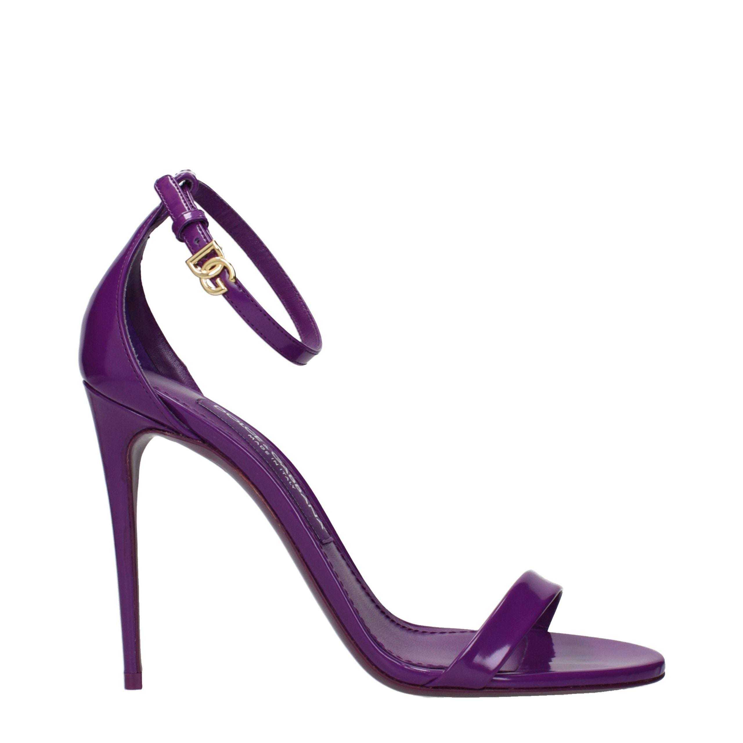 Step into a realm of elegance with Dolce & Gabbana's Purple Leather Stiletto Heel Sandals, a masterpiece of luxury that embodies sophistication and allure.