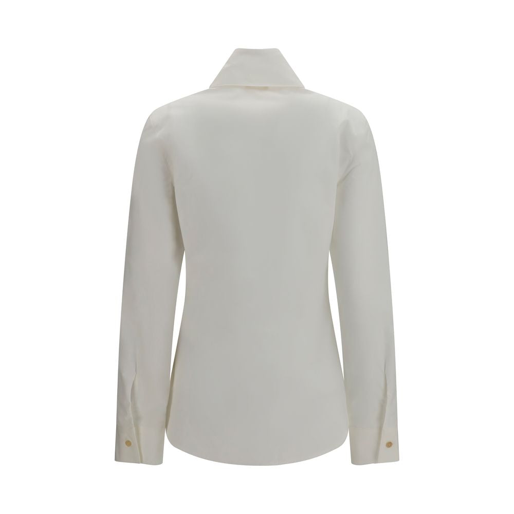 Discover the Khaite White Cotton Dress Shirt, a masterpiece of organic cotton poplin, embodying timeless elegance and sophisticated craftsmanship for the discerning individual.